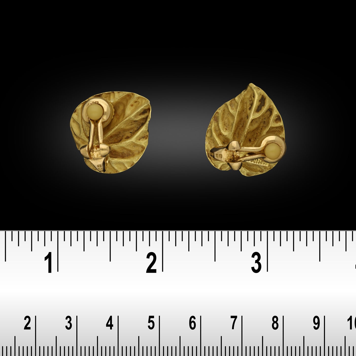 Andrew Grima 1960s 18KT Yellow Gold Diamond Cyclamen Leaf Earrings front view with ruler