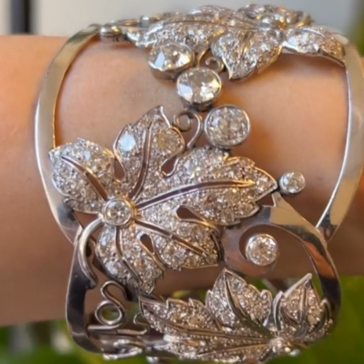 1950s Platinum Diamond Leaf Motif Bangle Bracelet worn on wrist