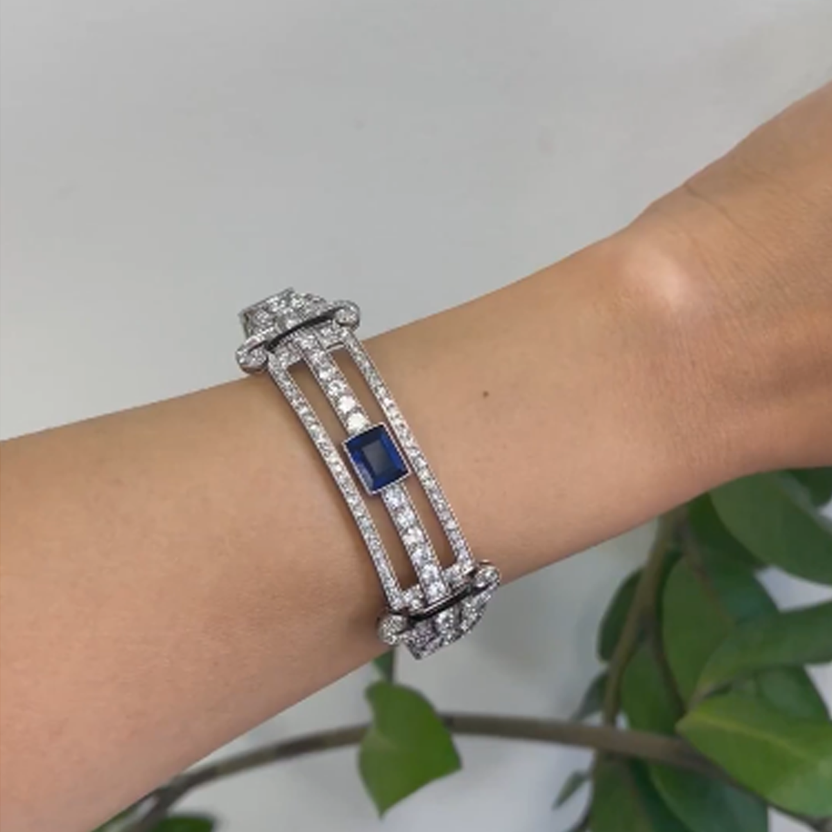 French Art Deco Platinum Sapphire, Diamond & Onyx Bangle Bracelet worn on wrist