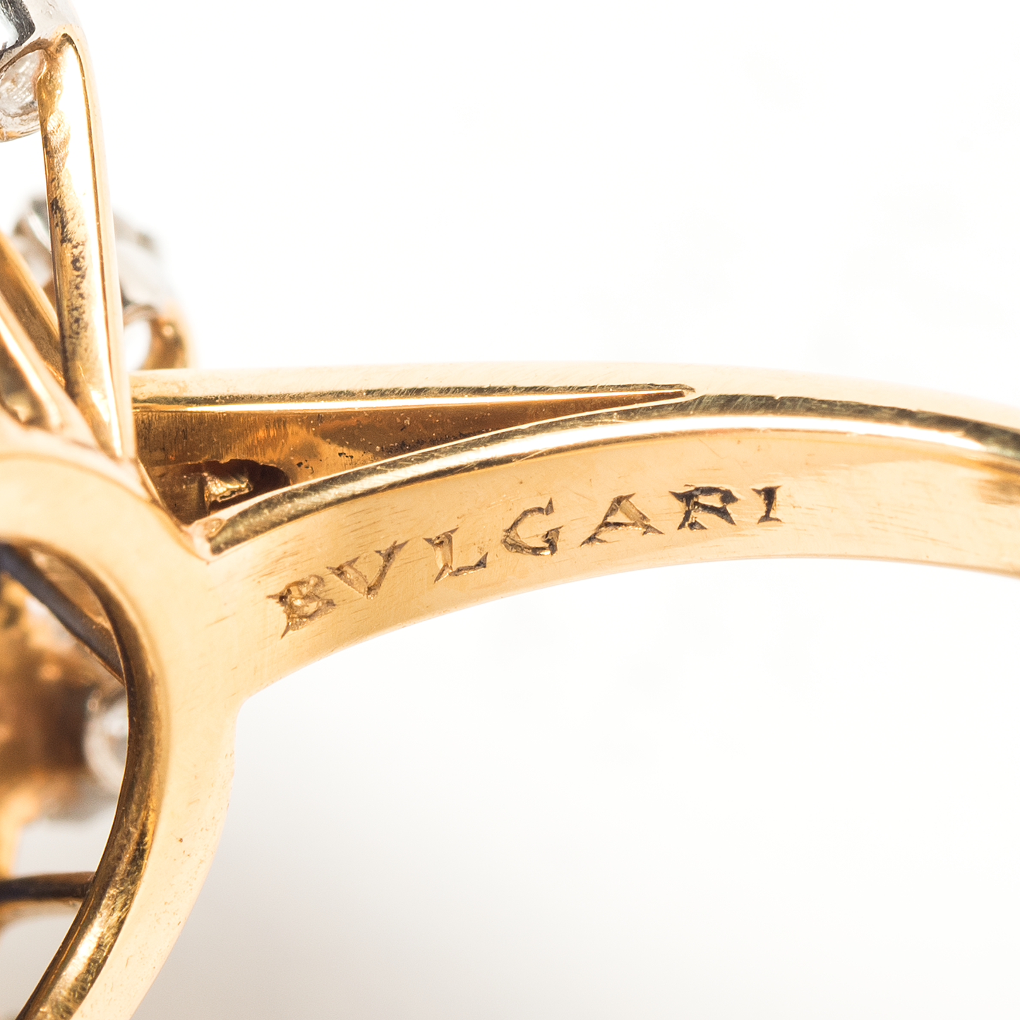 Bulgari 1960s 18KT Yellow Gold Ruby, Diamond, Emerald & Sapphire Ring close-up details of signature