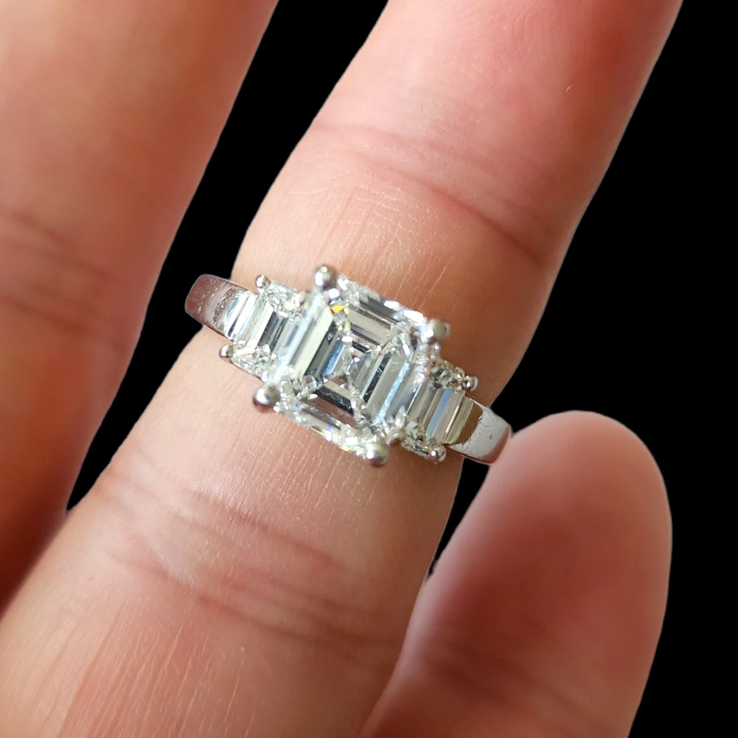 1980s Platinum Diamond Three-Stone Ring worn on finger