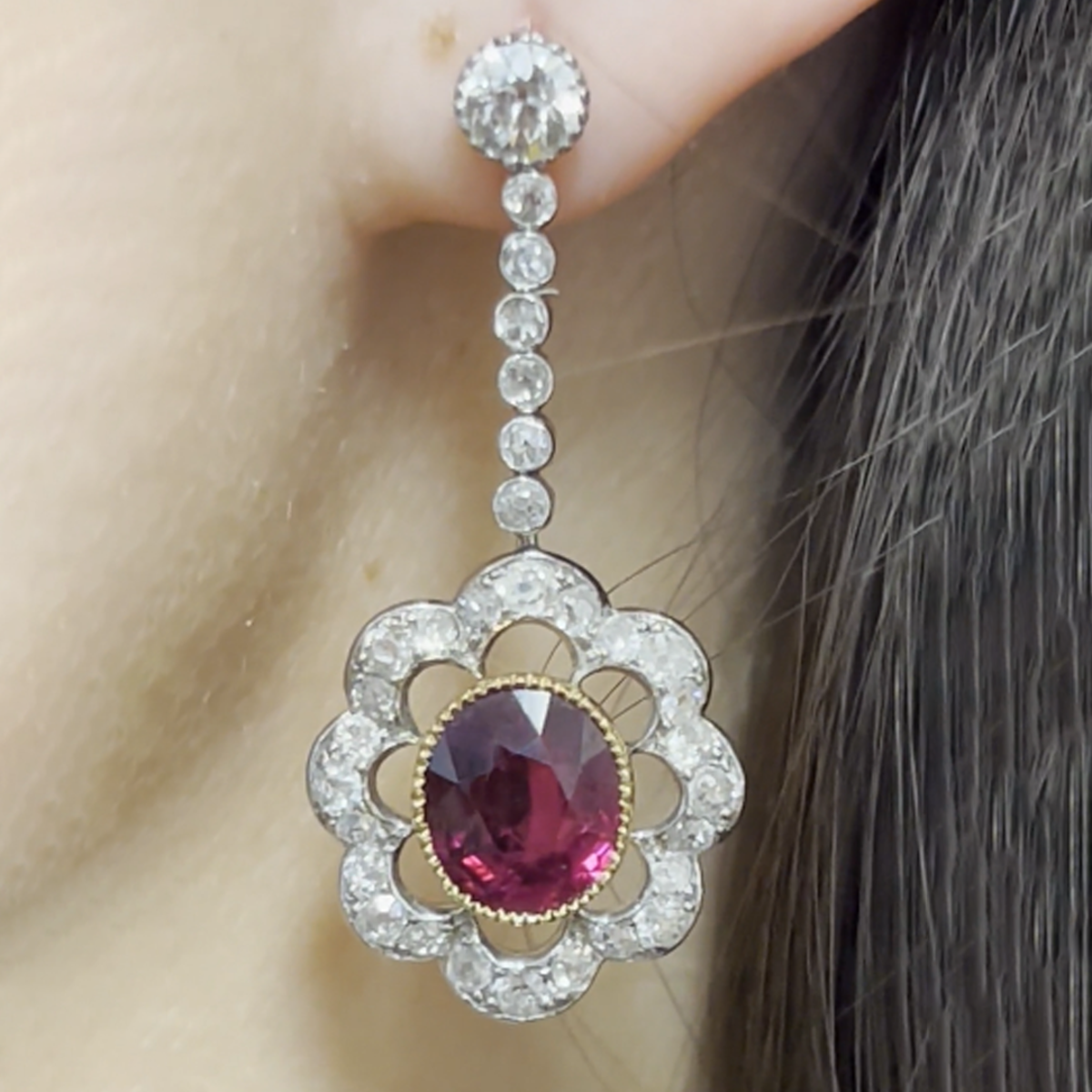 Edwardian Platinum Thai Unheated Ruby & Diamond Drop Earrings close-up on ear