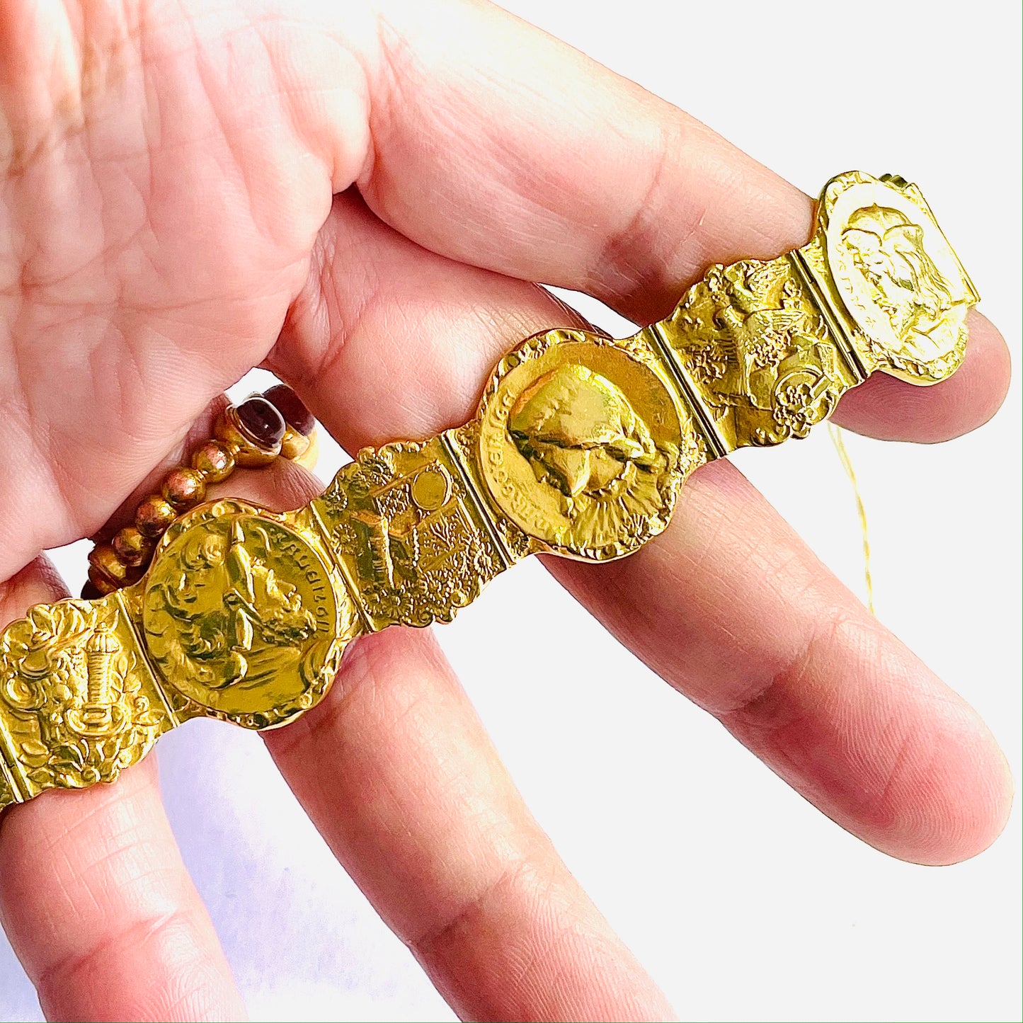 Antique 18KT Yellow Gold "Goethe's Faust" Bracelet in hand