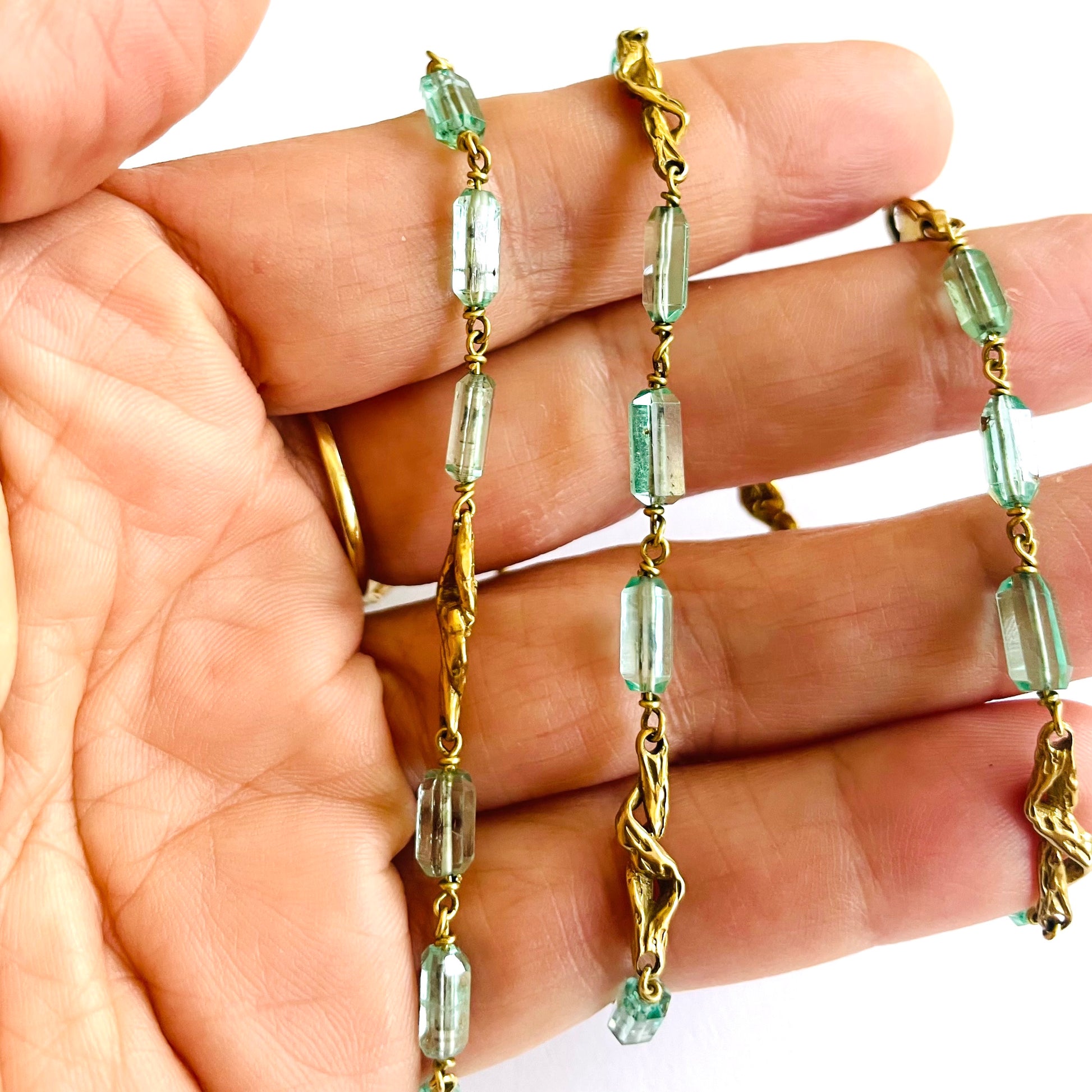 1970s 18KT & 8KT Yellow Gold Beryl Necklace in hand