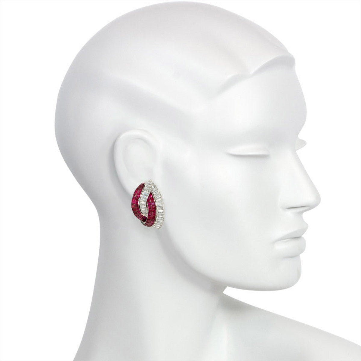 Retro Platinum Invisibly Set Ruby & Diamond Stylized Knot Earrings on ear