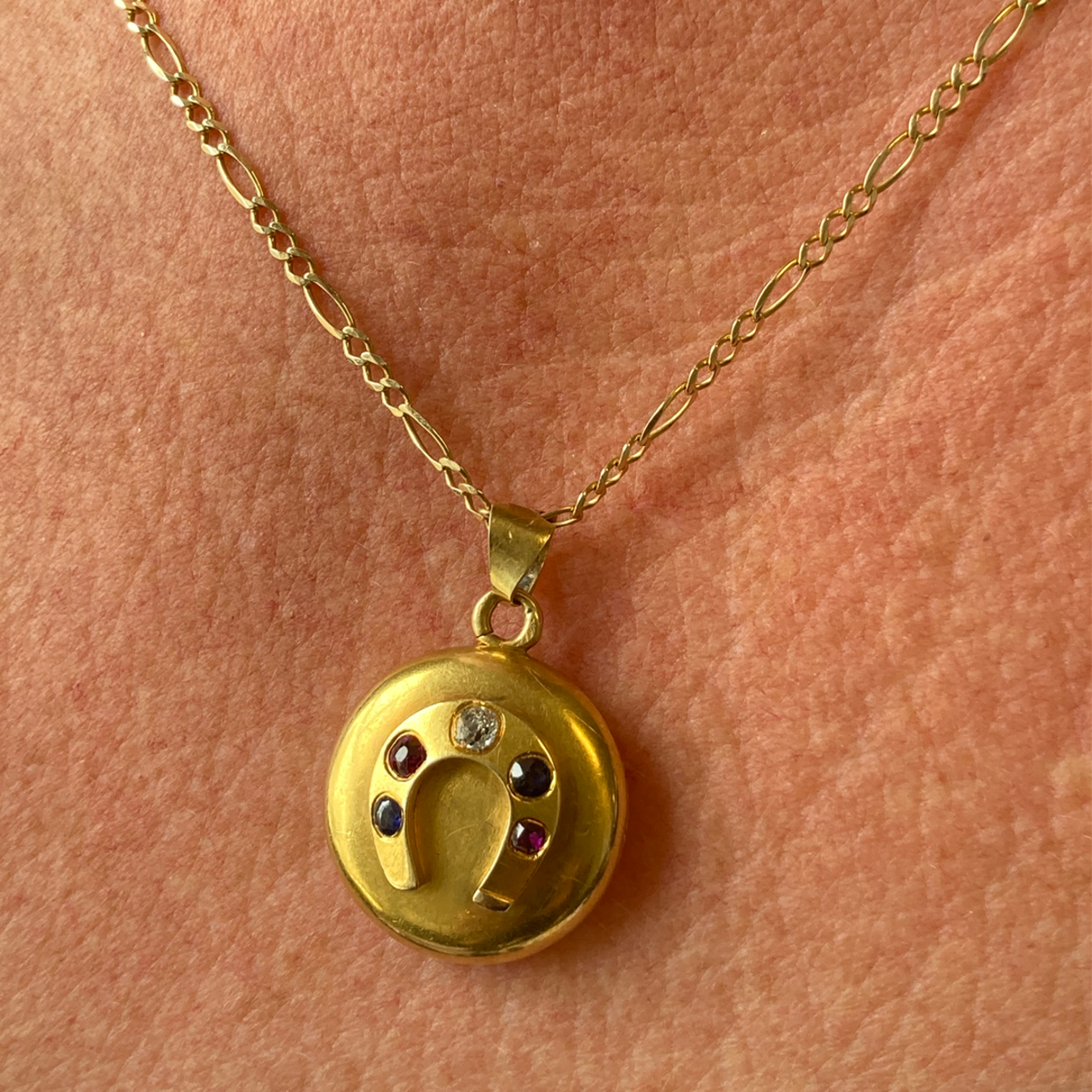 French Antique 18KT Yellow Gold Diamond, Ruby & Sapphire Horseshoe Locket worn on neck