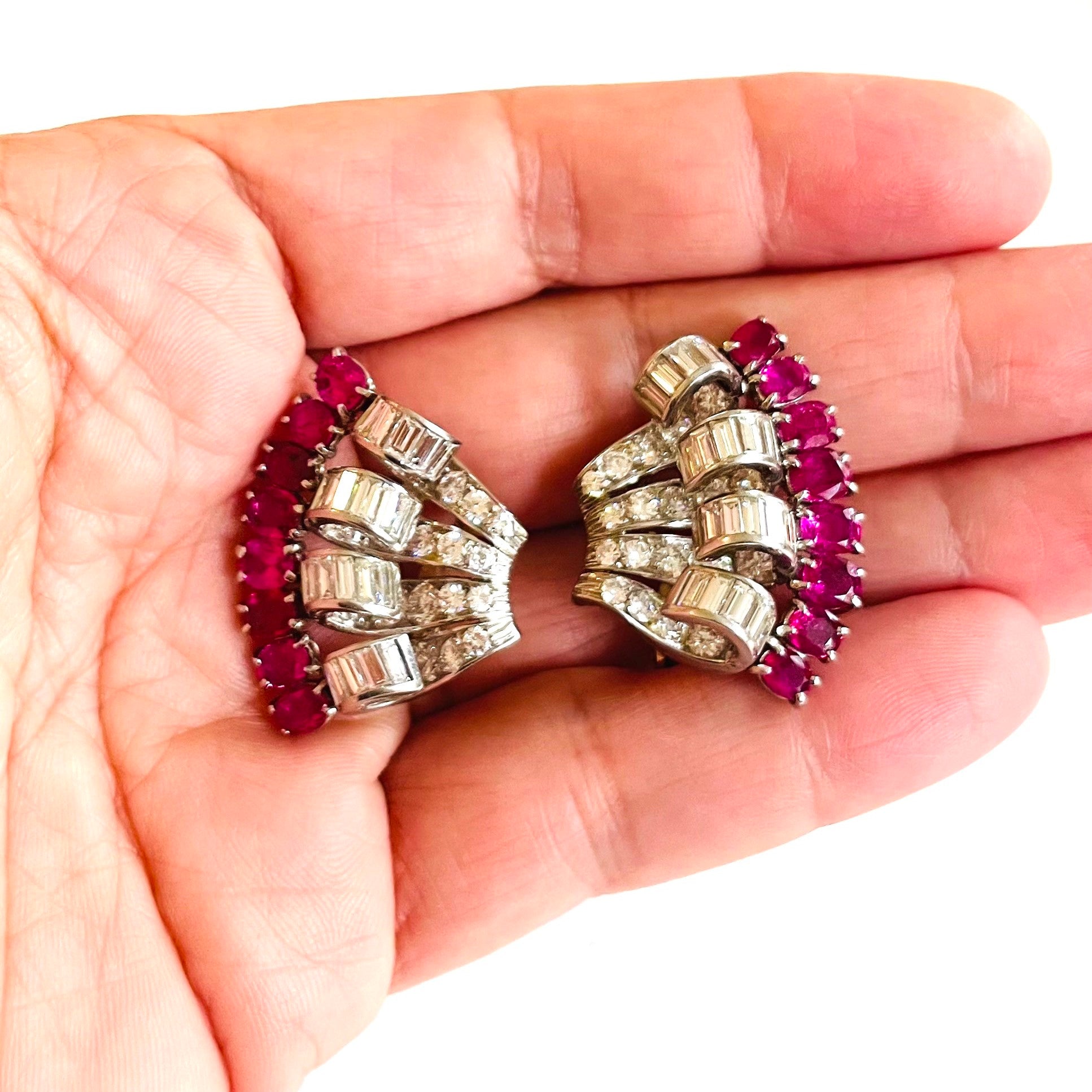 1960s Platinum Ruby & Diamond Earrings in hand