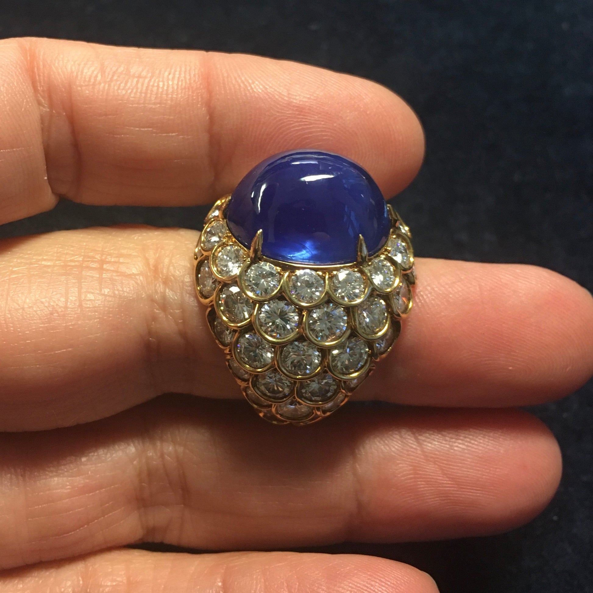 French 1960s 18KT Yellow Gold Unheated Blue Sapphire & Diamond Ring on finger