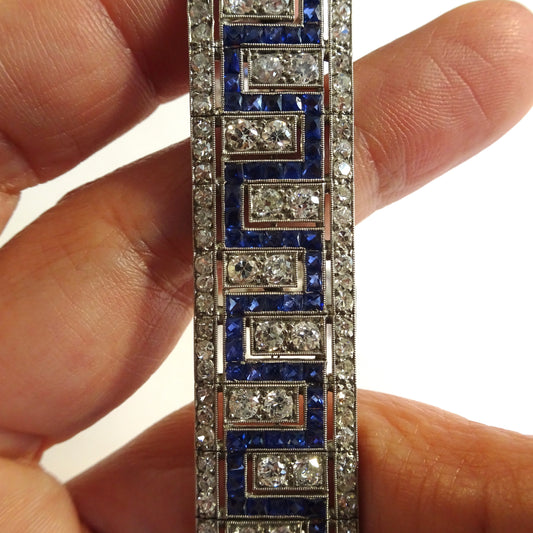 Art Deco Platinum Diamond & Sapphire Bracelet in hand