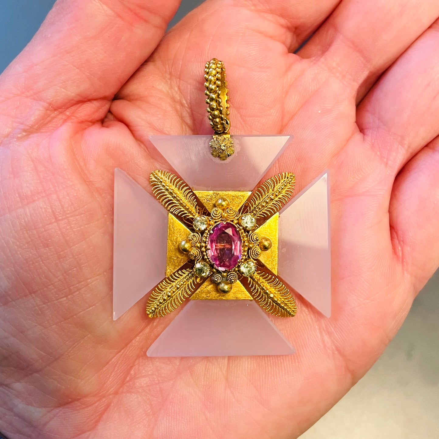 Victorian 18KT Yellow Gold Agate & Pink Topaz Maltese Cross Pendant in hand