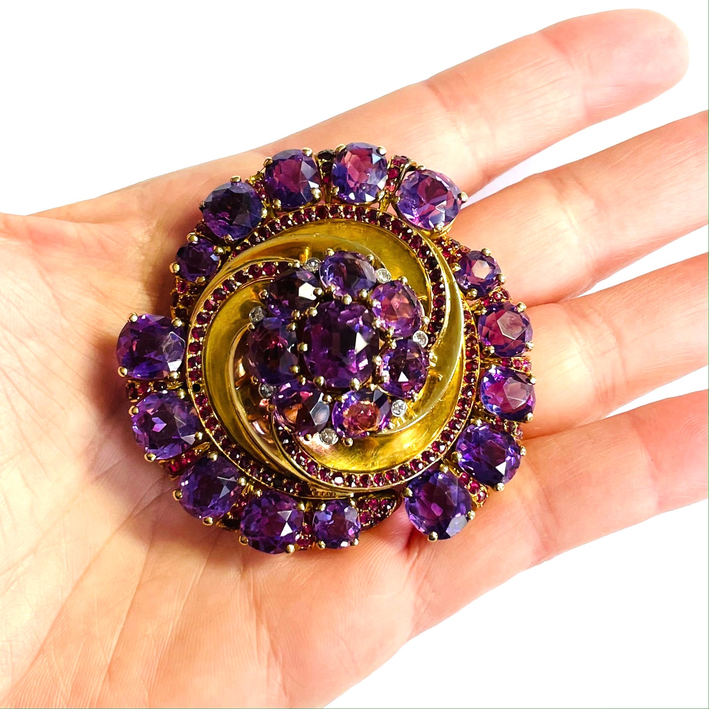 French 1940s 18KT Yellow Gold Amethyst, Diamond & Ruby Brooch in hand