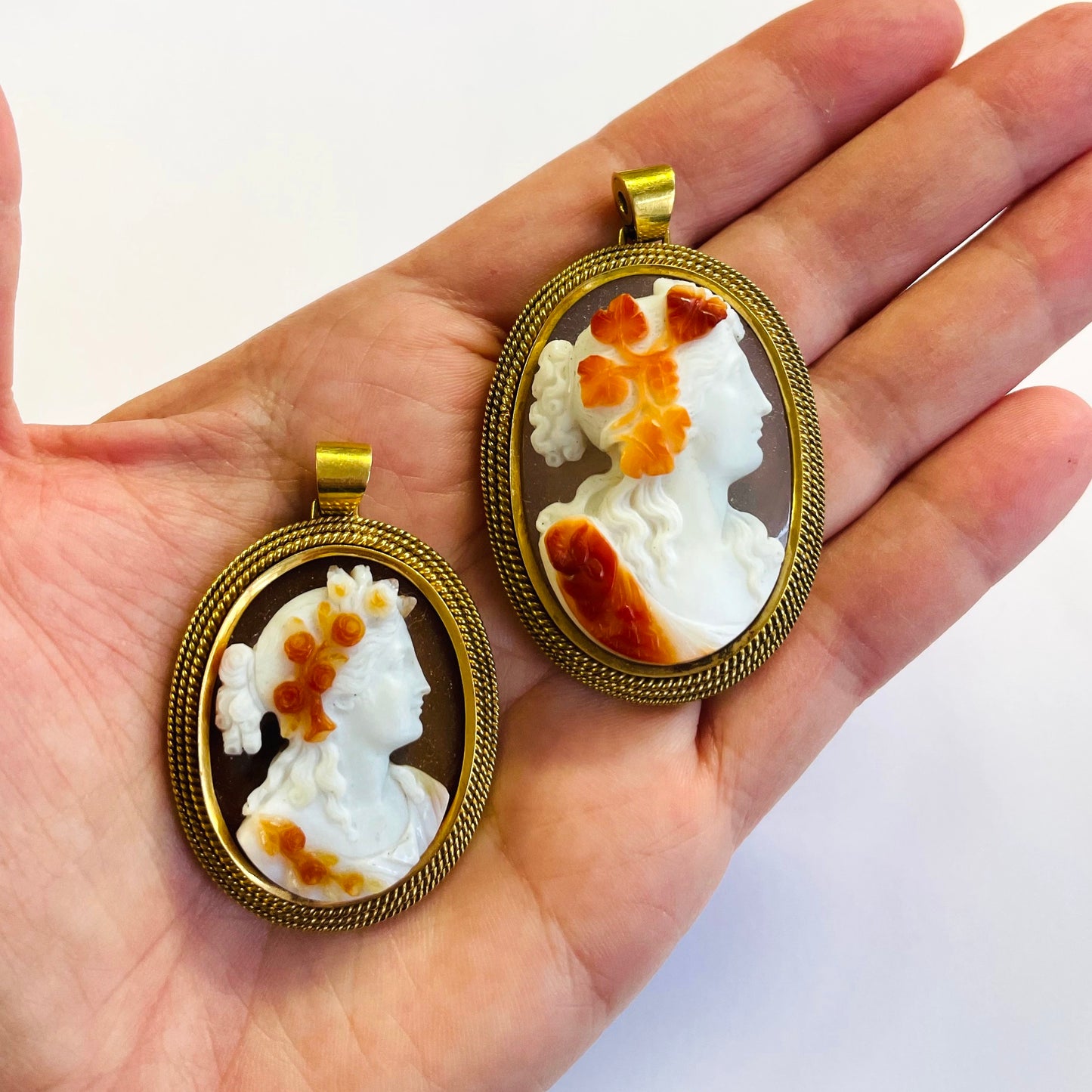 Victorian 18KT Yellow Gold Agate Pendants in hand