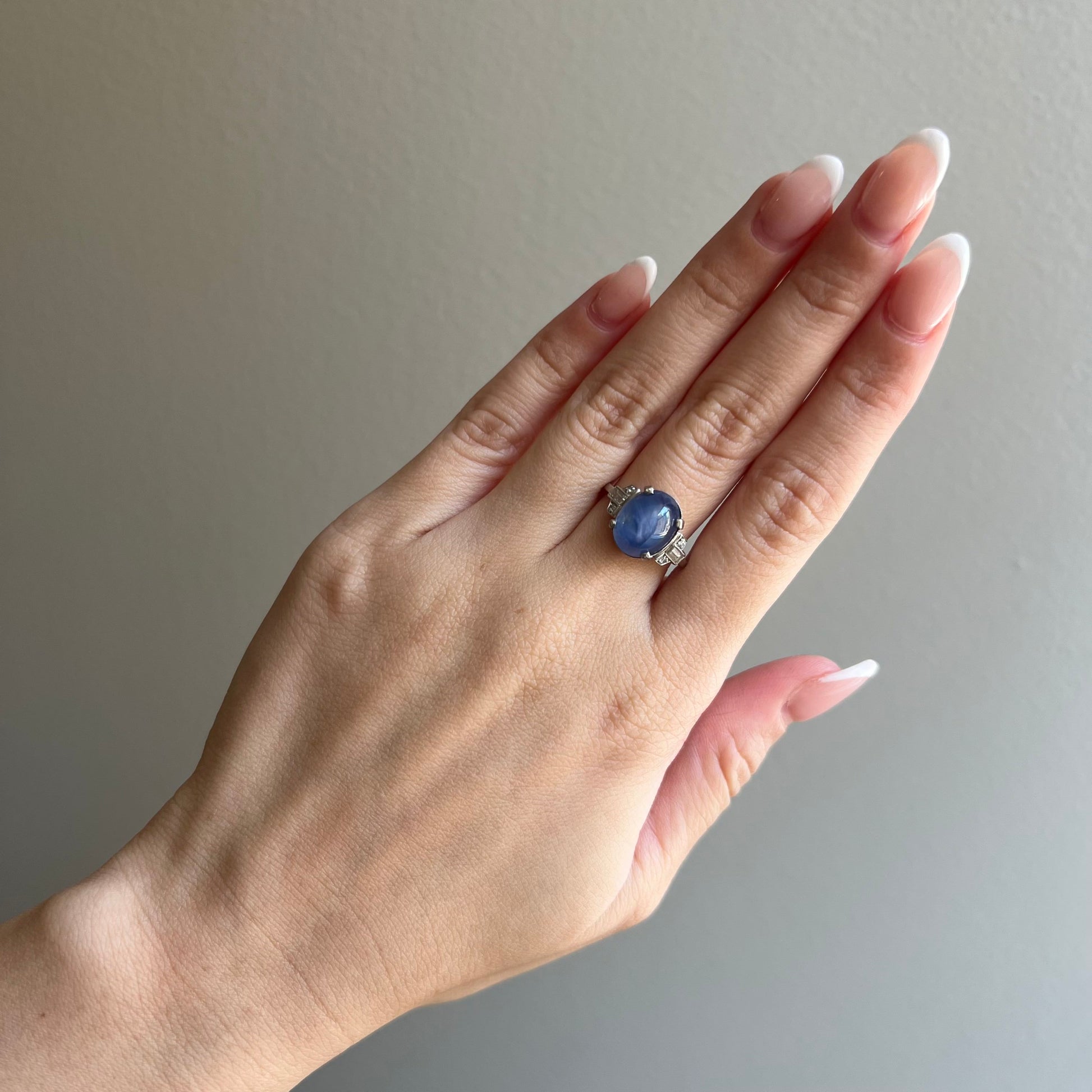 Art Deco Platinum Blue Star Sapphire & Diamond Ring worn on finger