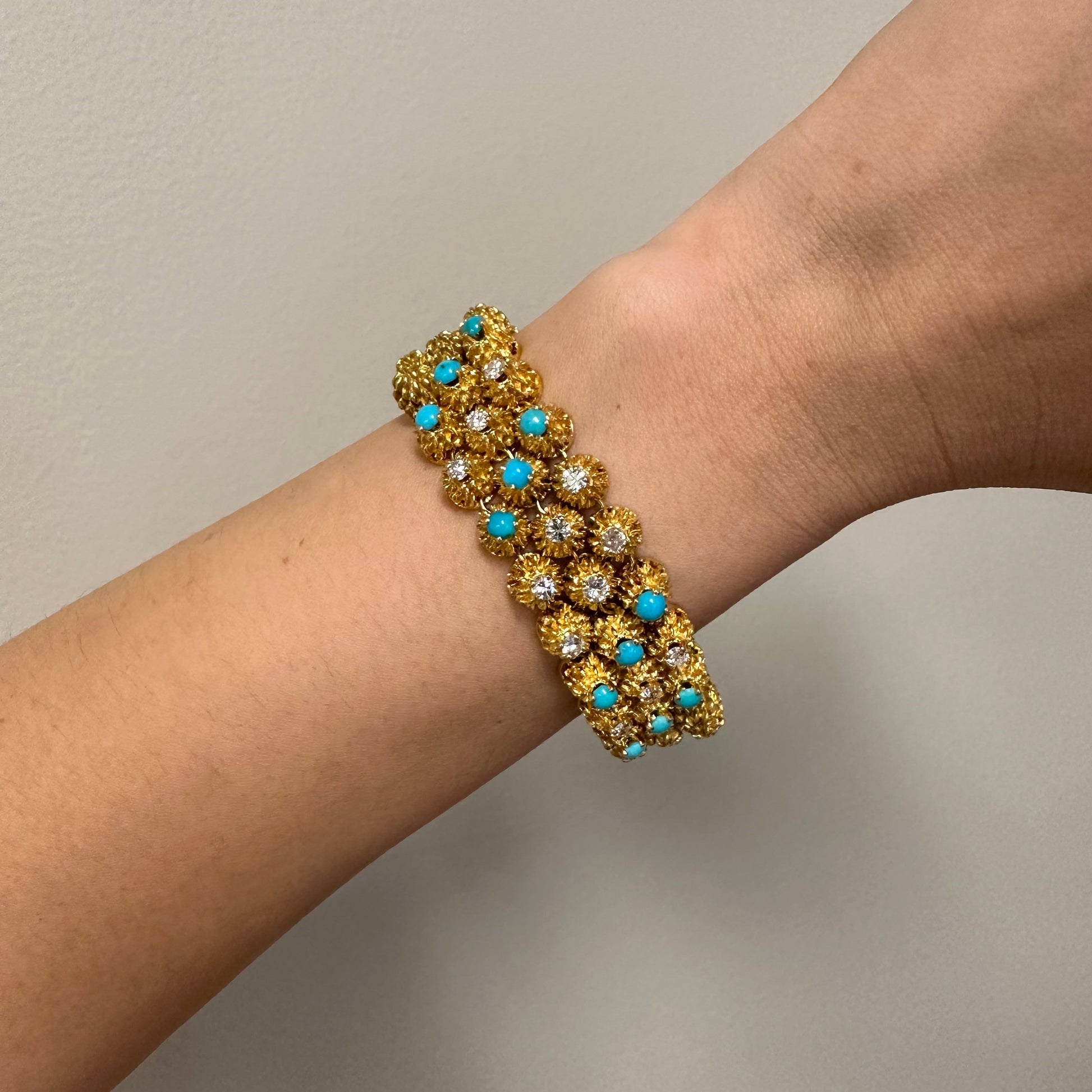 1970s French 18KT Yellow Gold Diamond & Turquoise Bracelet on wrist