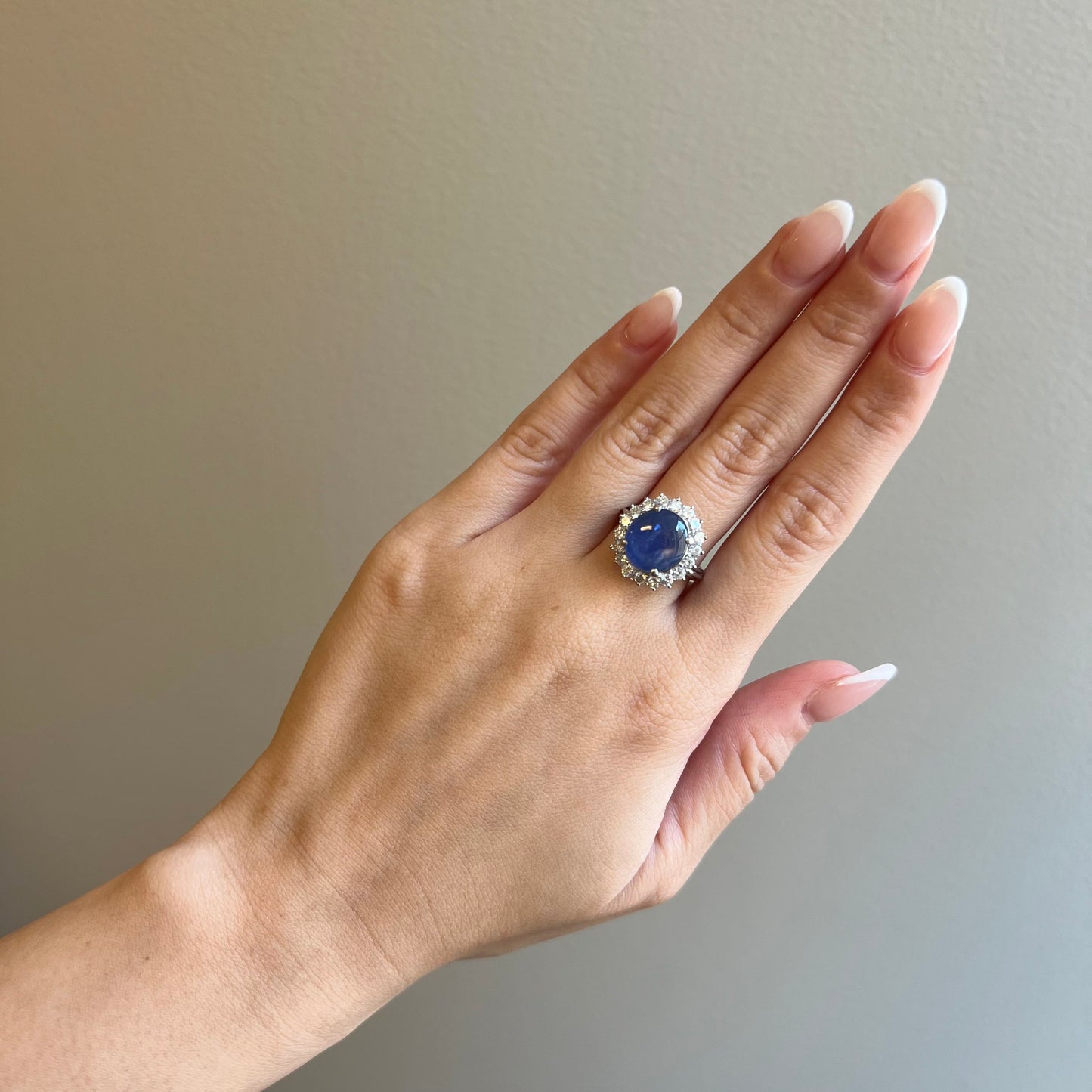 Post-1980s Platinum Blue Sapphire & Diamond Ring worn on finger