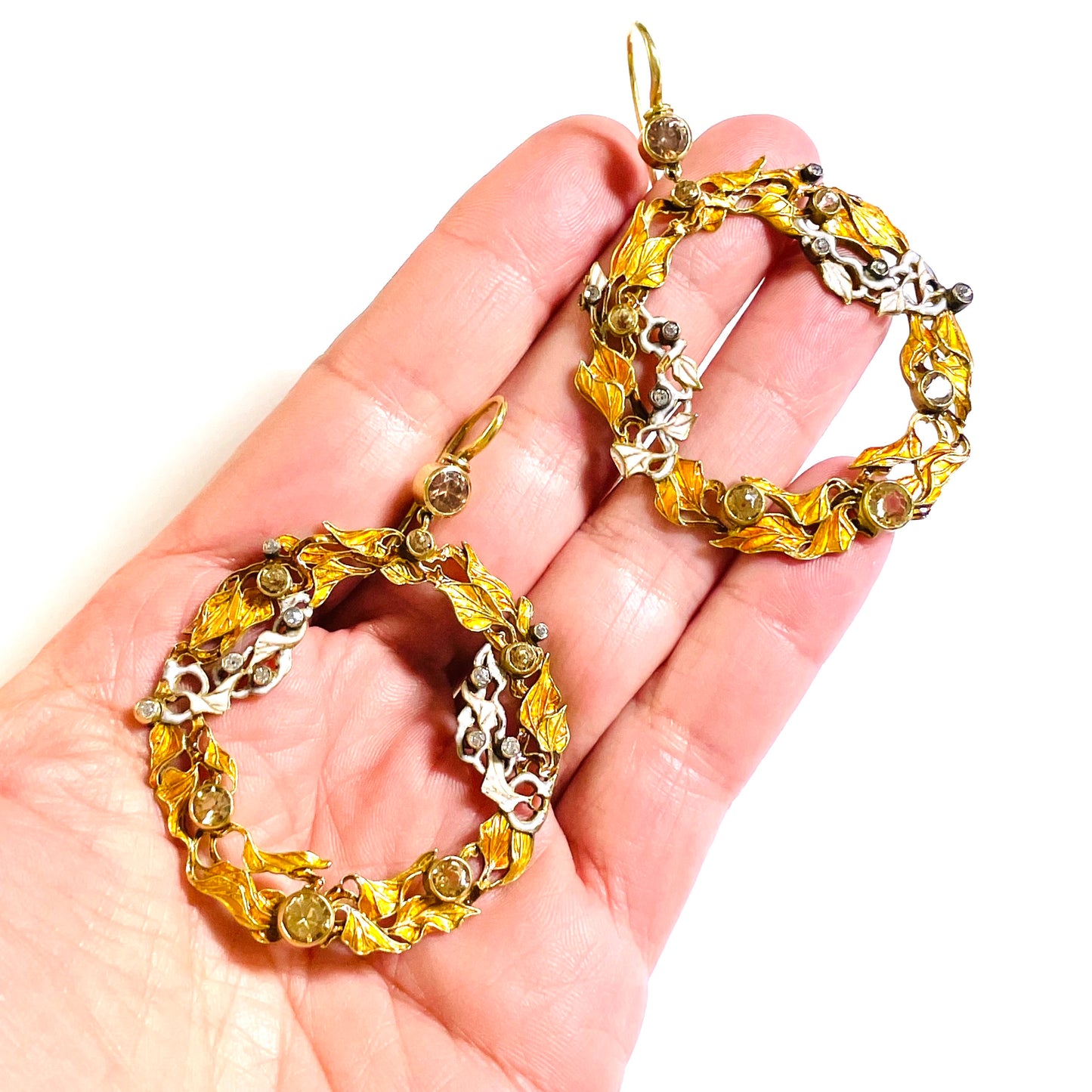 Art Nouveau 18KT Yellow Gold Diamond & Enamel Earrings in hand