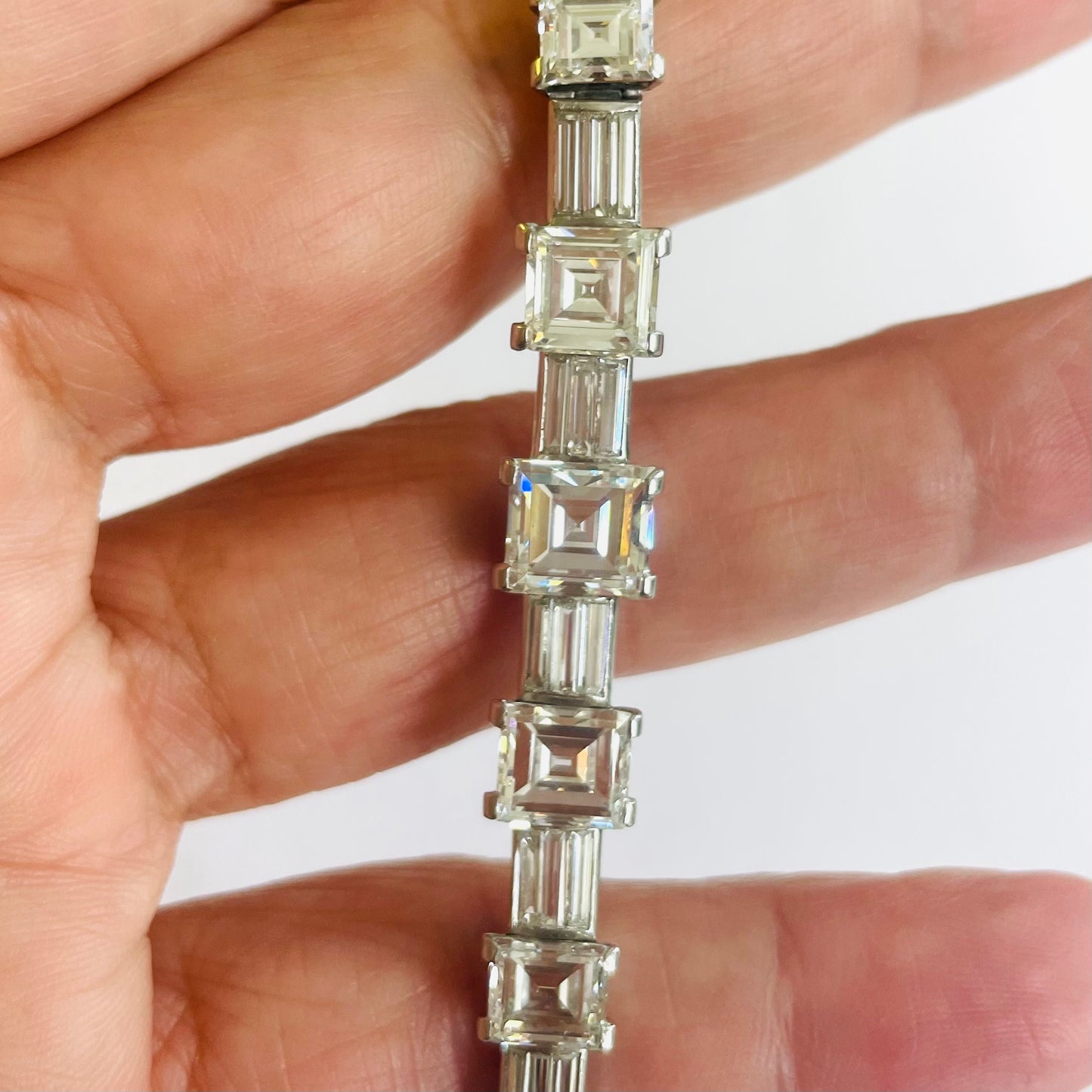 French 1980s Platinum Diamond Bracelet in hand
