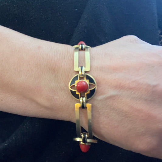 French Art Deco 18KT Yellow Gold Coral & Enamel Bracelet on wrist