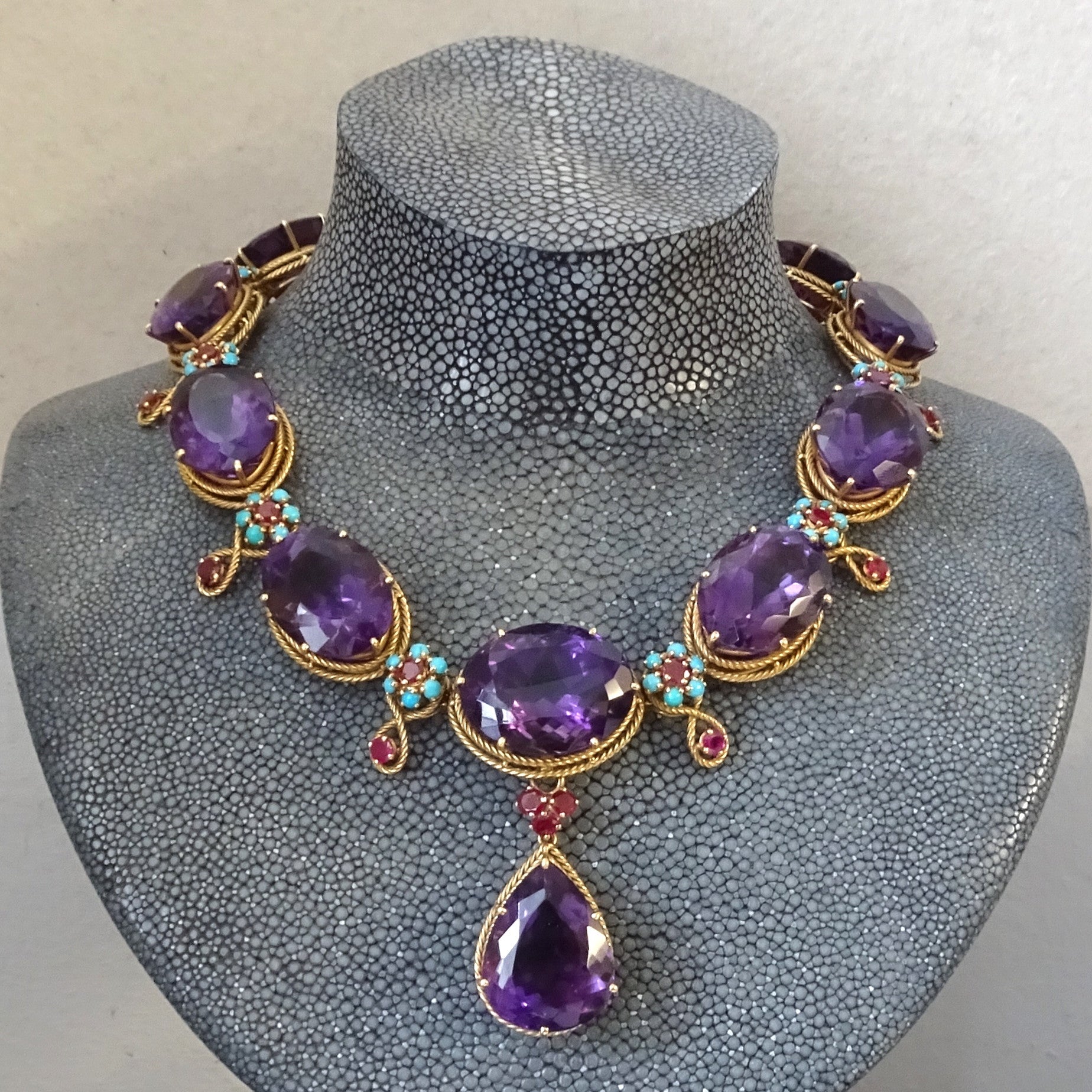 1960s 18KT Yellow Gold Amethyst, Ruby & Turquoise Necklace on form
