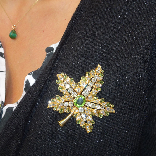 René Boivin 1940s 18KT Yellow Gold Diamond & Peridot Leaf Brooch worn on blouse