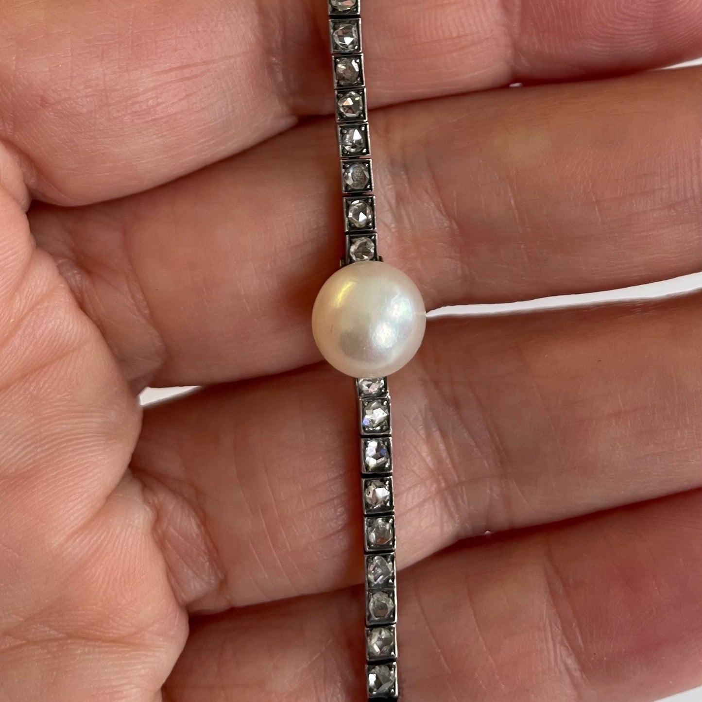 Victorian Silver Natural Pearl & Diamond Bracelet in hand