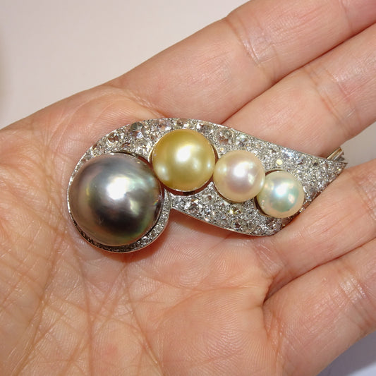 Rene Boivin French 1940s Platinum & 18KT Yellow Gold Diamond & Cultured Pearl Brooch in hand