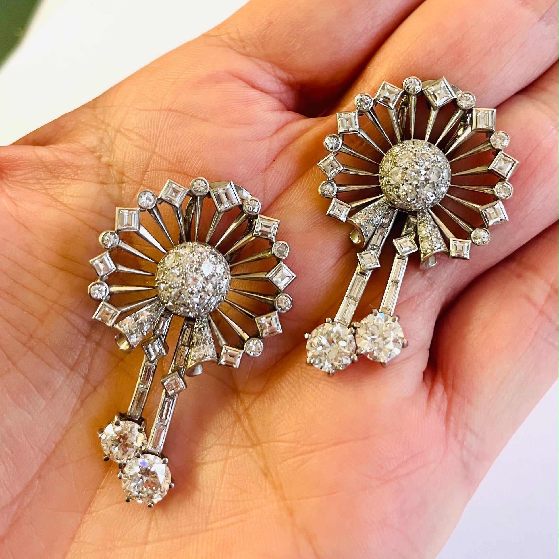 Platinum Diamond Earrings in hand