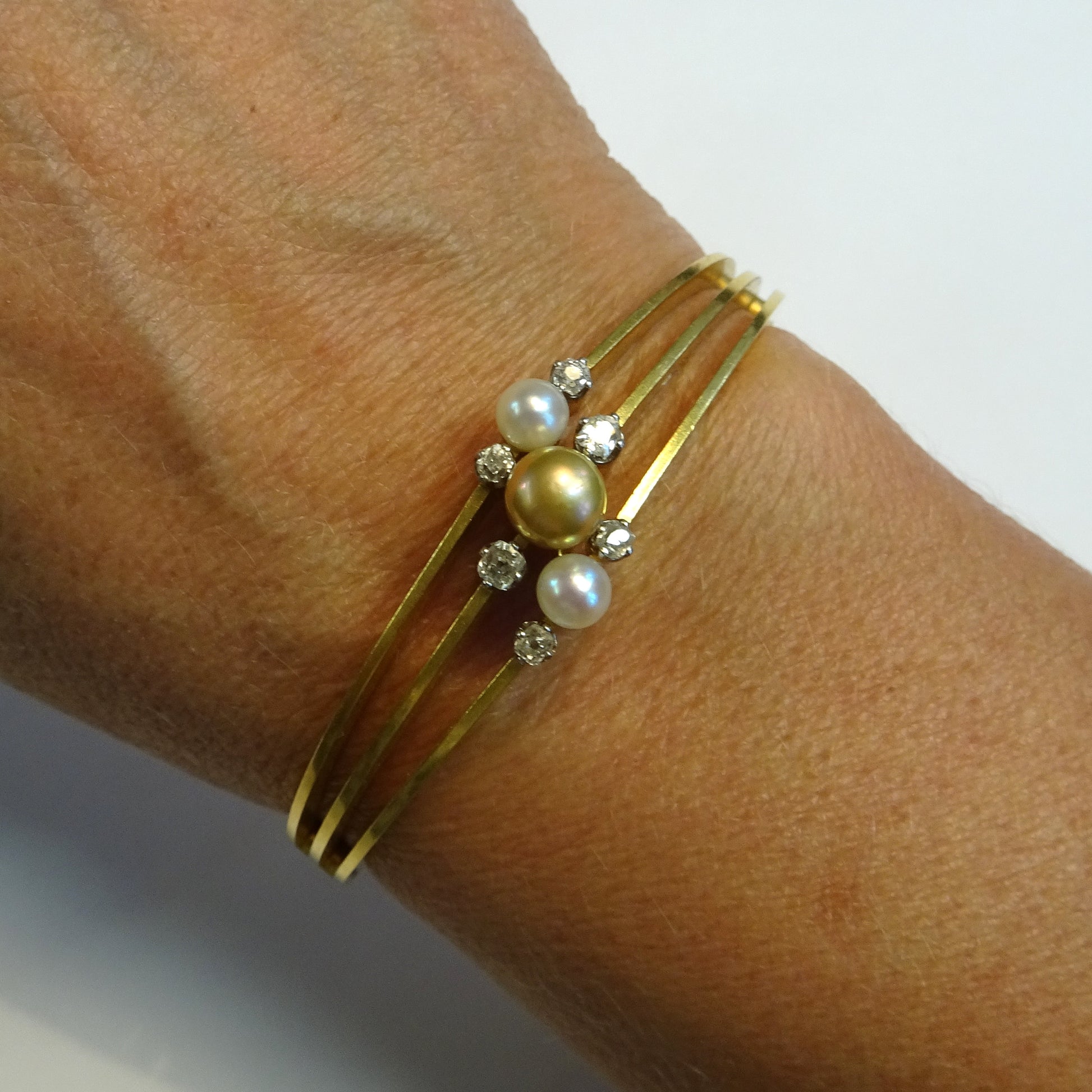 Bapst & Falize Paris Antique 18KT Yellow Gold Natural Pearl Bangle Bracelet worn on wrist