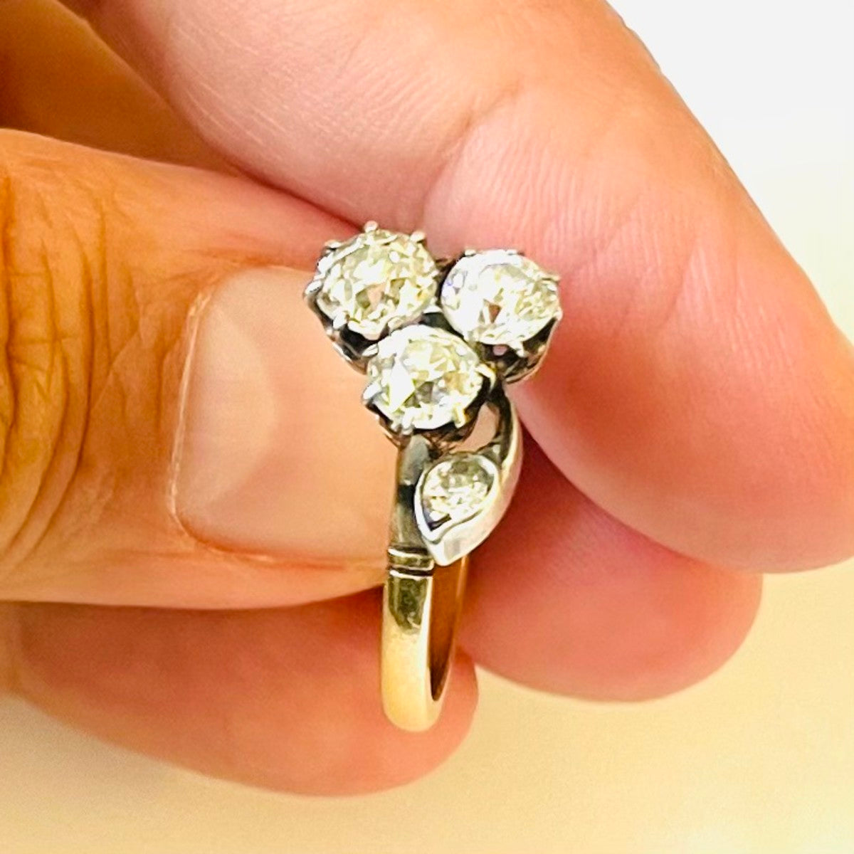 Victorian Silver & 18KT Yellow Gold Diamond Ring in hand