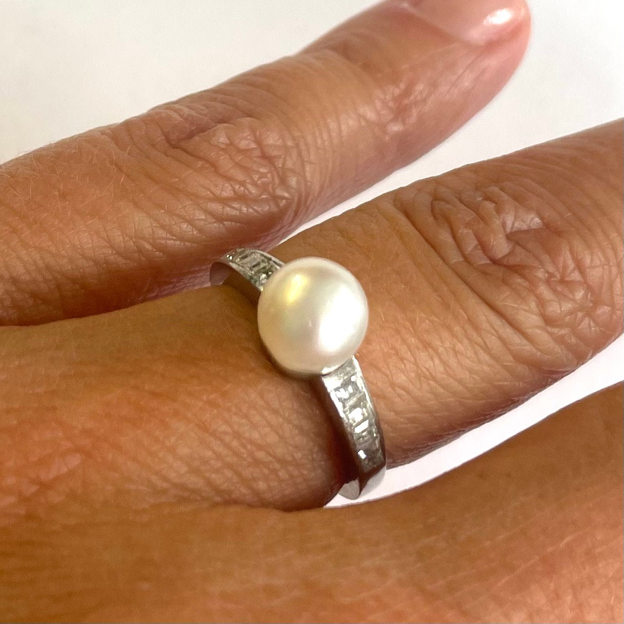 1980s Palladium Natural Pearl & Diamond Ring on finger