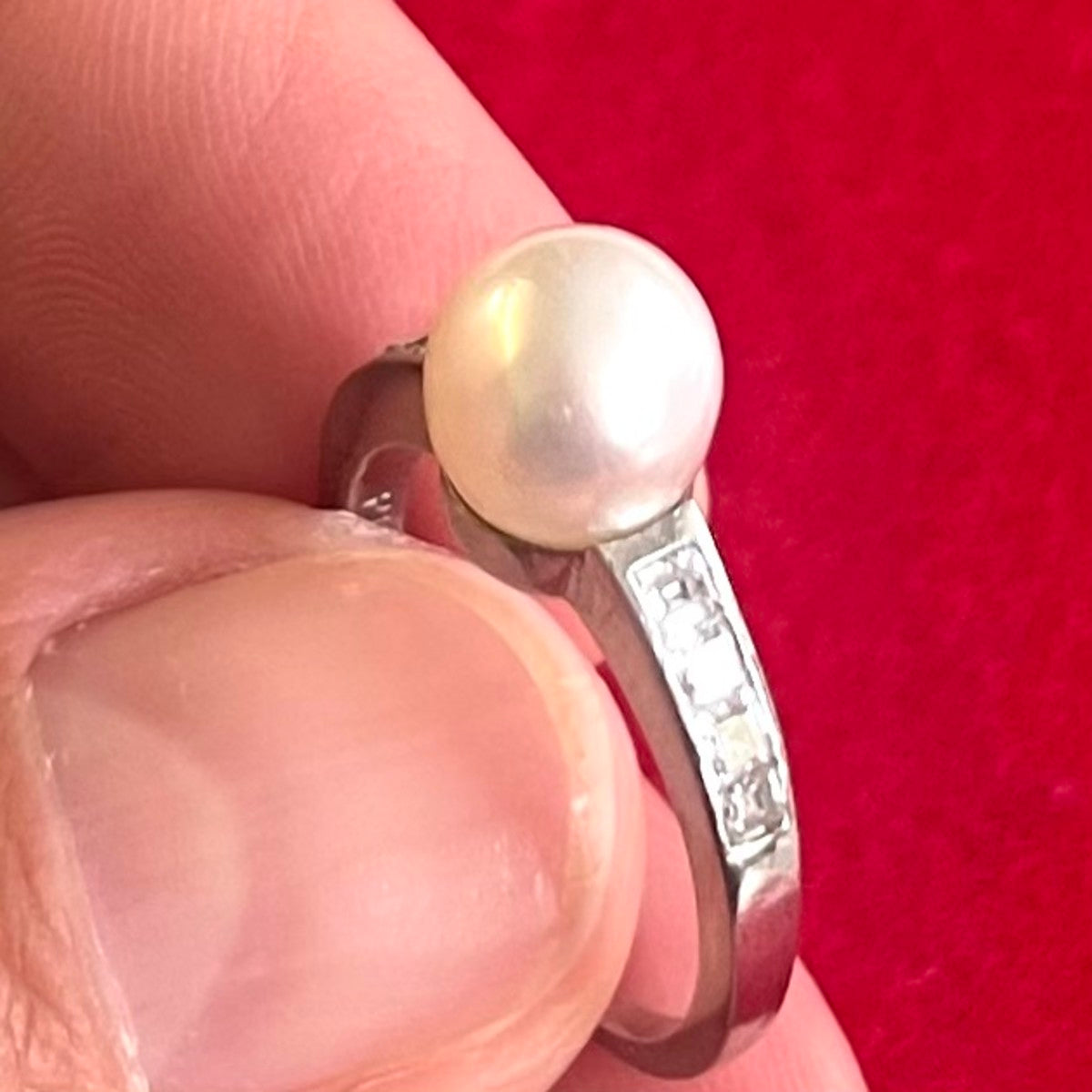 1980s Palladium Natural Pearl & Diamond Ring in hand