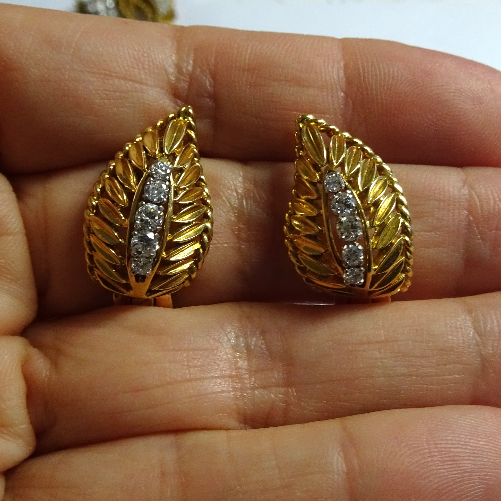 Pery Fils French 1950s 18KT Yellow Gold Diamond Earrings in hand