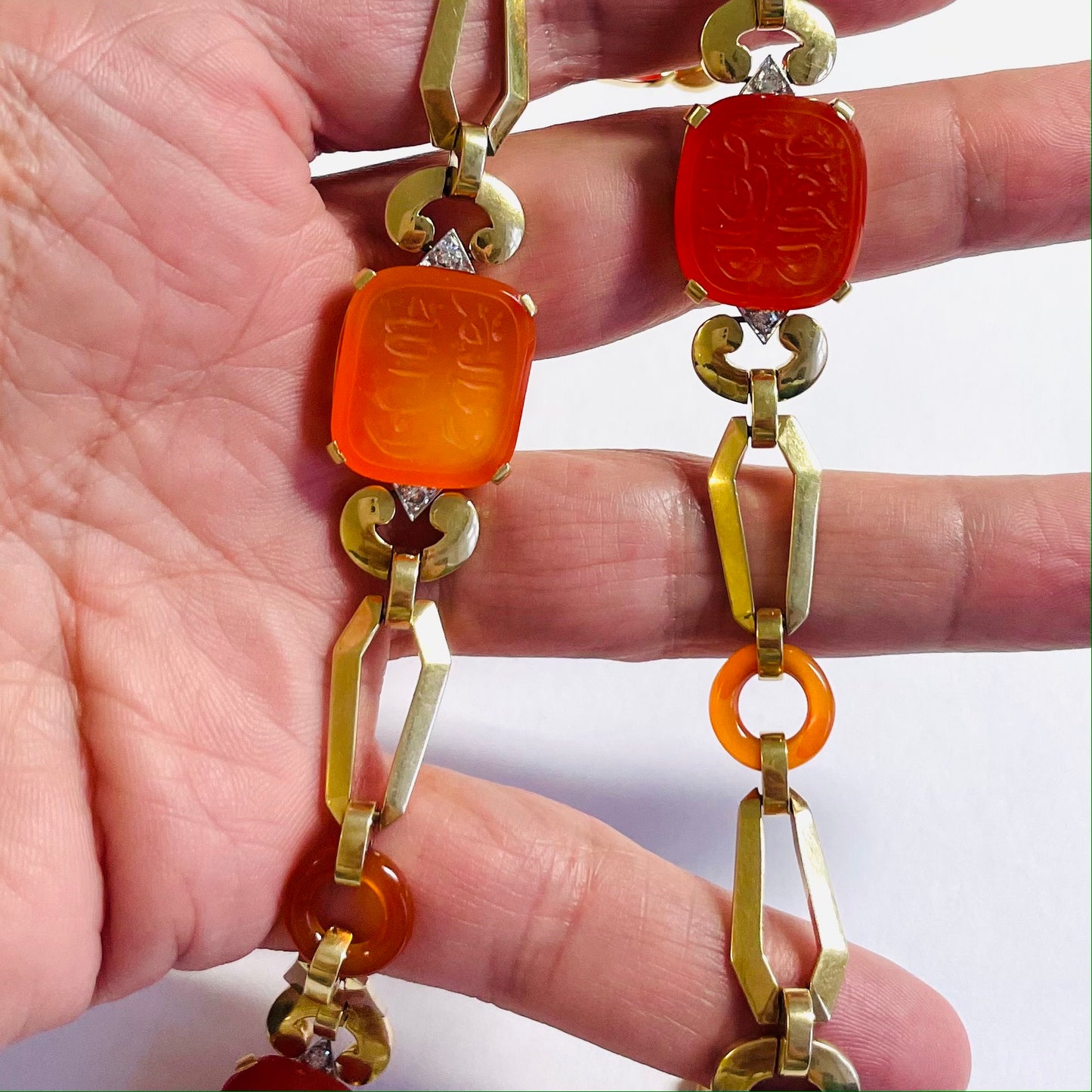 1930s 18KT White Gold Carnelian Agate & Diamond Necklace in hand