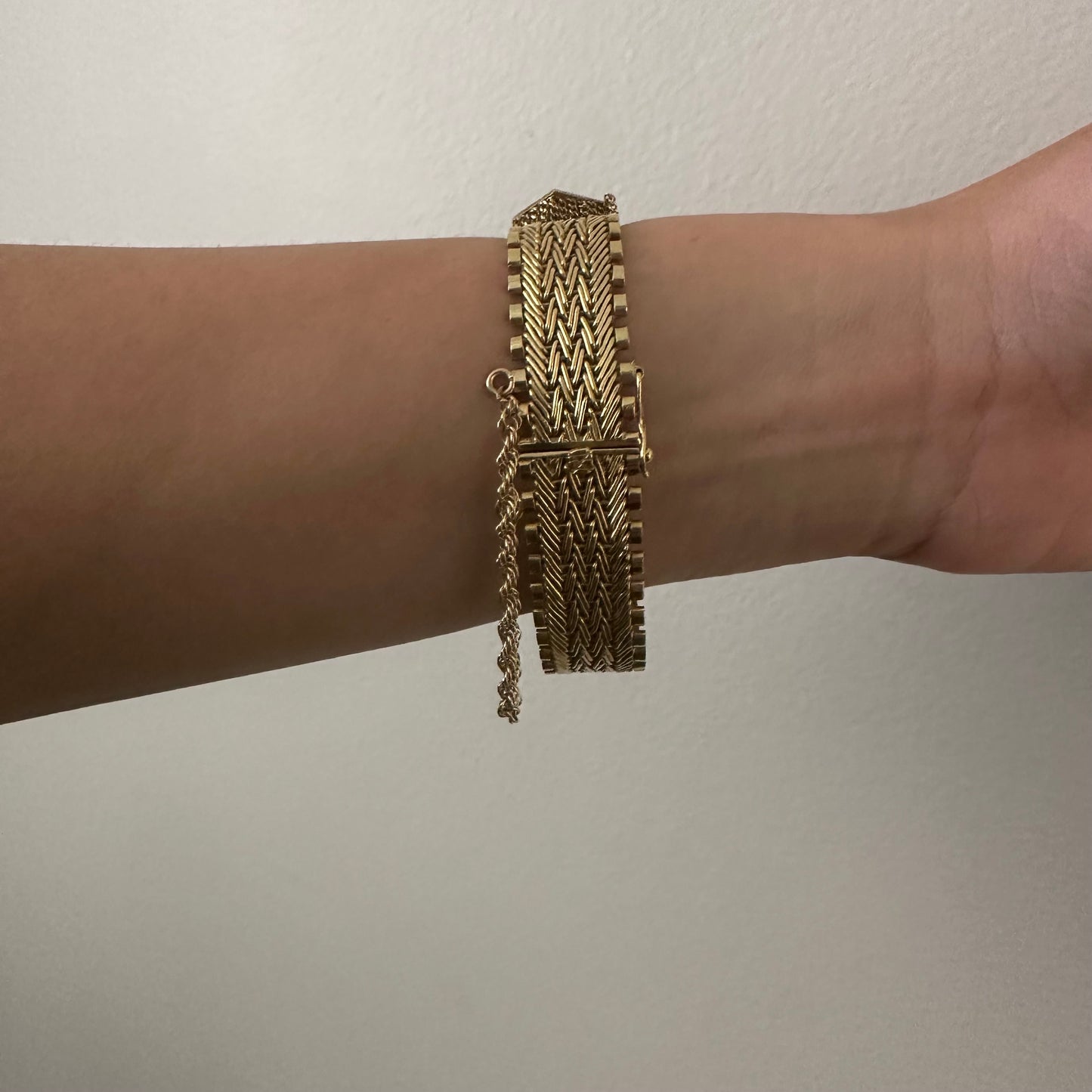 1960s 18KT Yellow Gold Tassel Bracelet worn on wrist