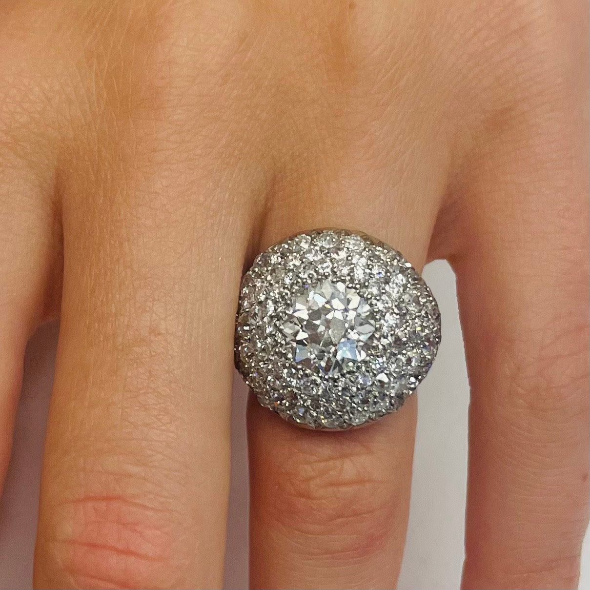 French 1930s Platinum Diamond Bombé Ring worn on finger