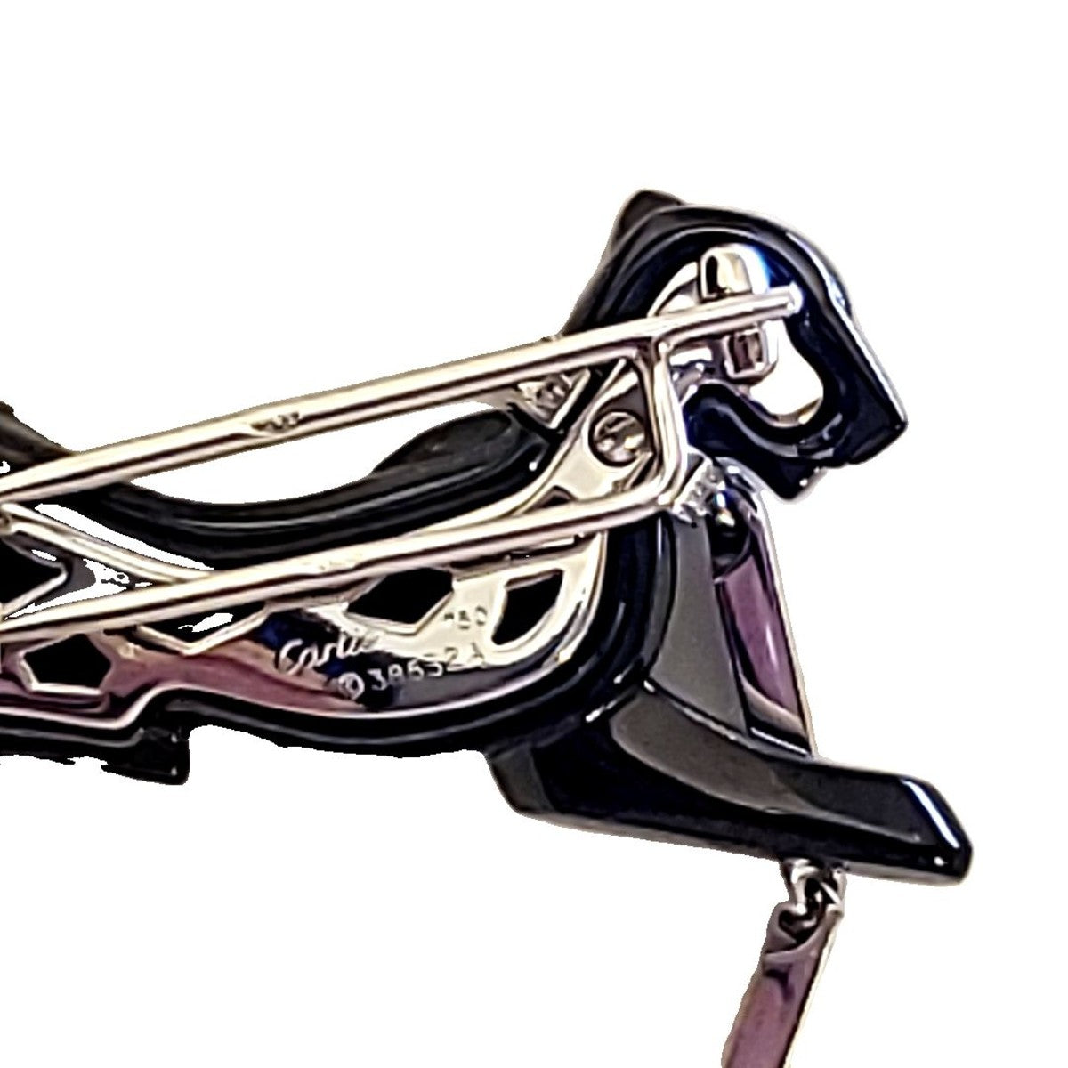 Cartier Paris 18KT White Gold Onyx & Emerald Panther Brooch close-up of signature