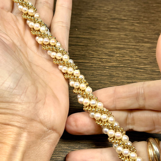 Van Cleef & Arpels Paris Post-1980s 18KT Yellow Gold Pearl & Gold Bracelet in hand