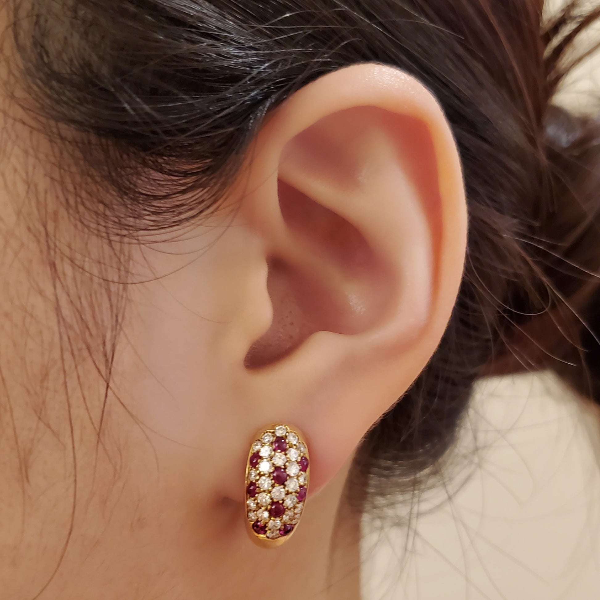 Cartier 1980s 18KT Yellow Gold Ruby & Diamond Earrings on ear