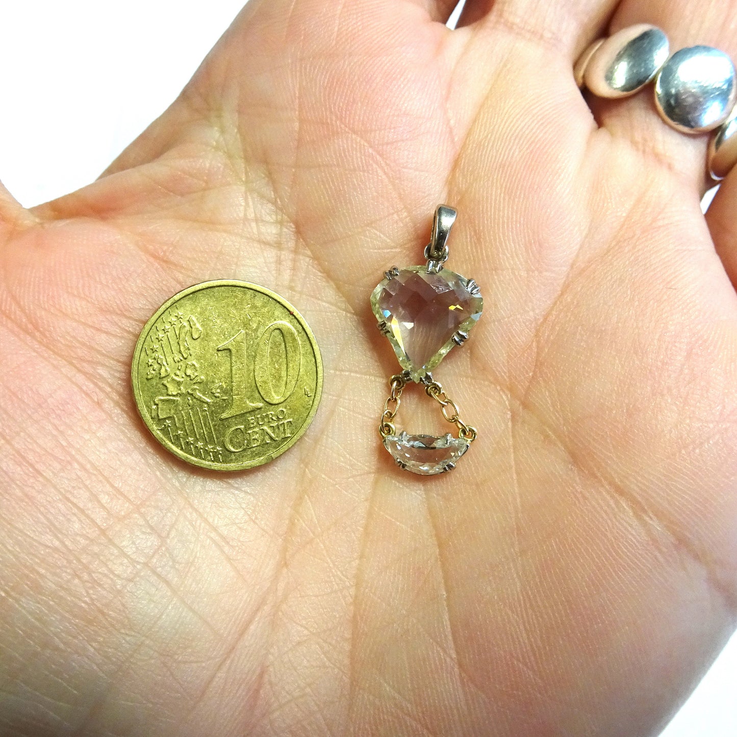 1930s Platinum & 18KT Yellow Gold Diamond Hot Air Balloon Pendant in hand for scale