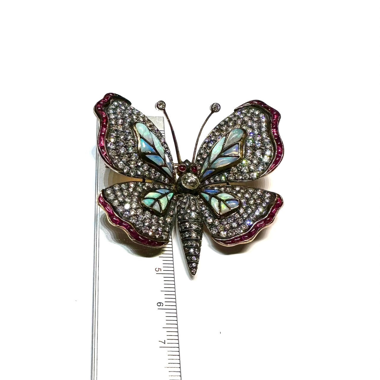 Post-1980s Silver & 18KT Yellow Gold Diamond, Opal & Ruby Butterfly Brooch with ruler for scale