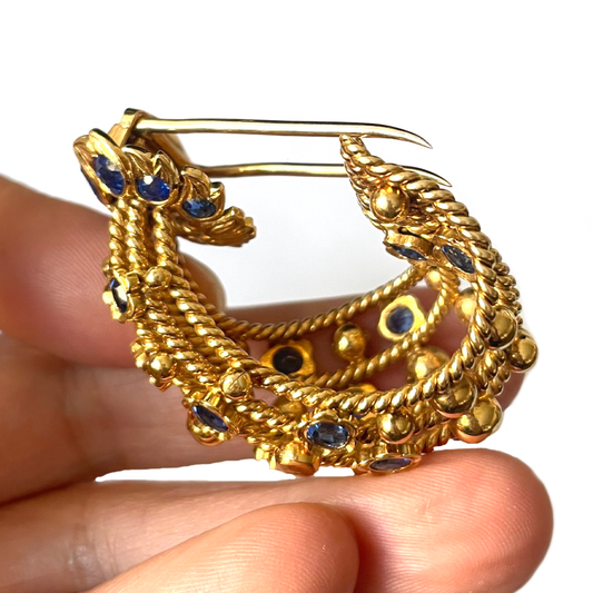 Cartier Paris 1950s 18KT Yellow Gold Sapphire Brooch in hand