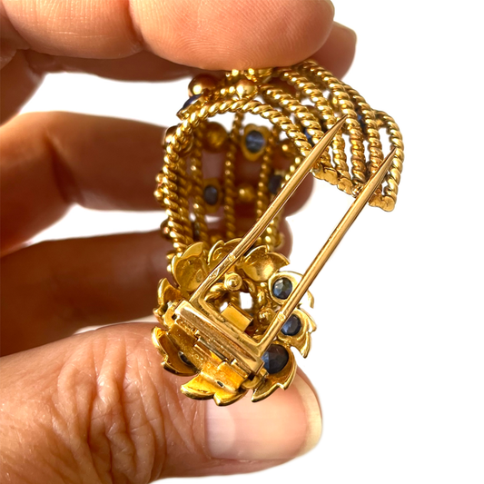 Cartier Paris 1950s 18KT Yellow Gold Sapphire Brooch in hand