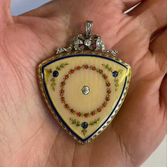 Victorian 18KT Yellow Gold Enamel, Diamond & Sapphire Locket in hand