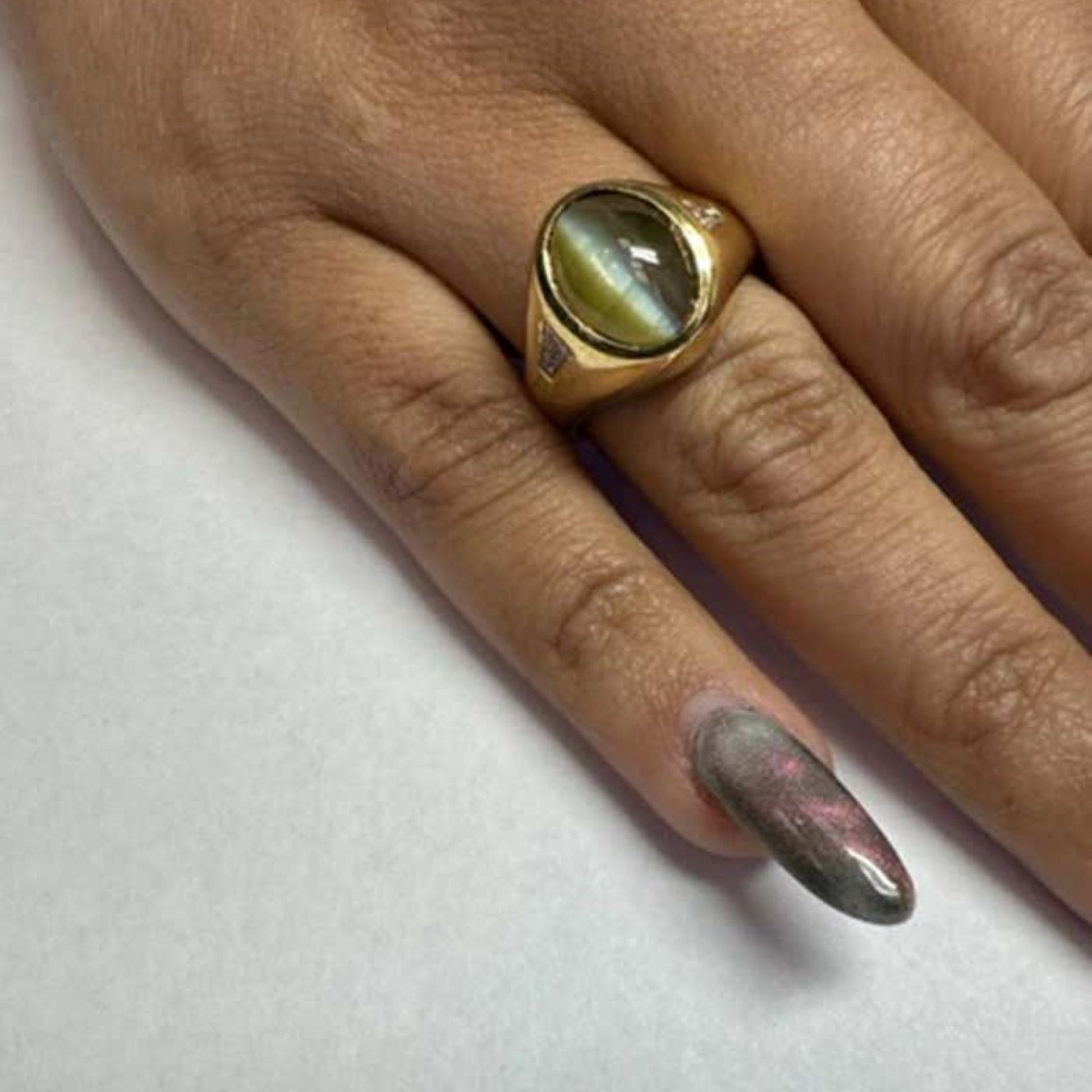 1950s 18KT Yellow Gold Chrysoberyl Cat's Eye & Diamond Ring worn on finger