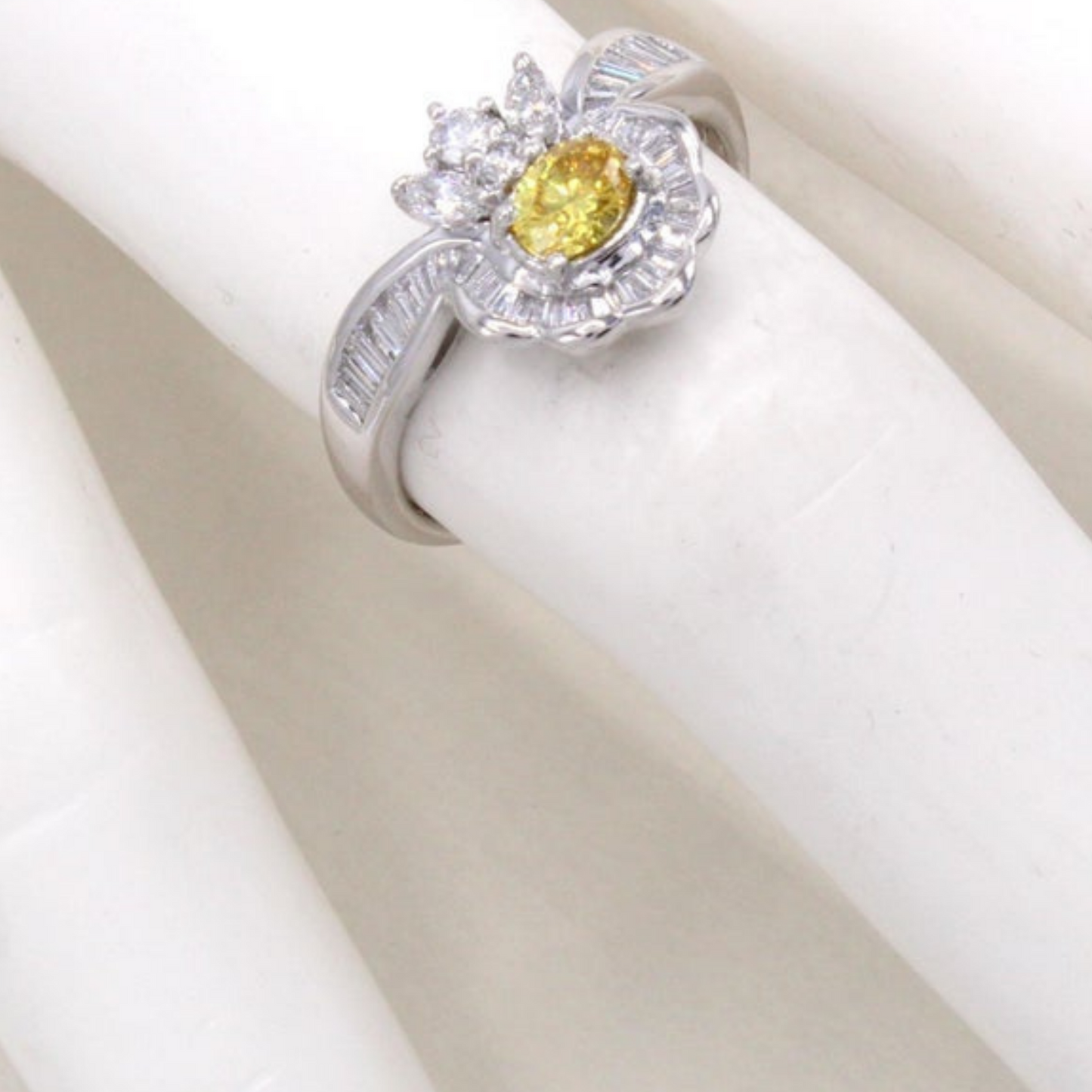 Post-1980s Platinum Fancy Vivid Orange-Yellow Diamond Ring on finger
