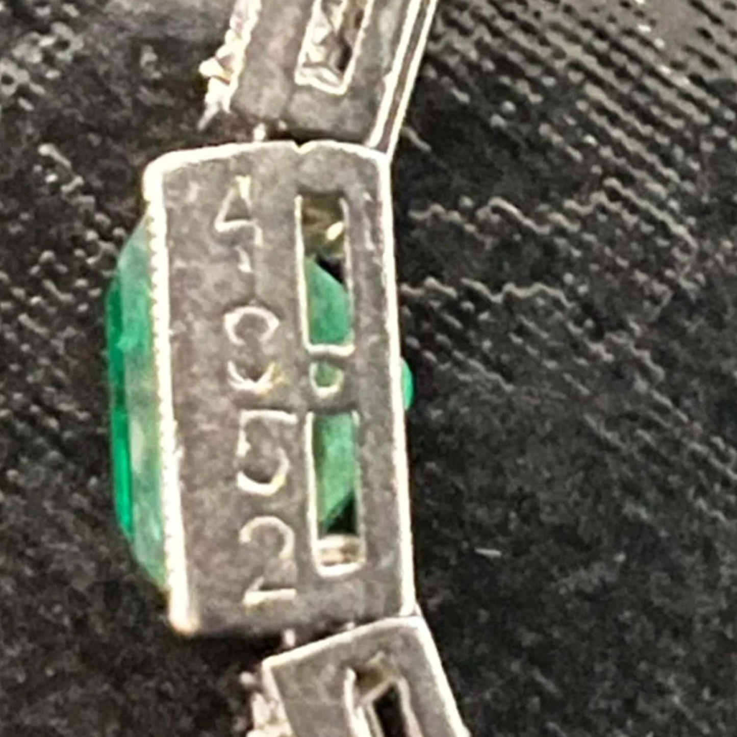 Cartier Art Deco Platinum Diamond & Emerald Bracelet close-up of number