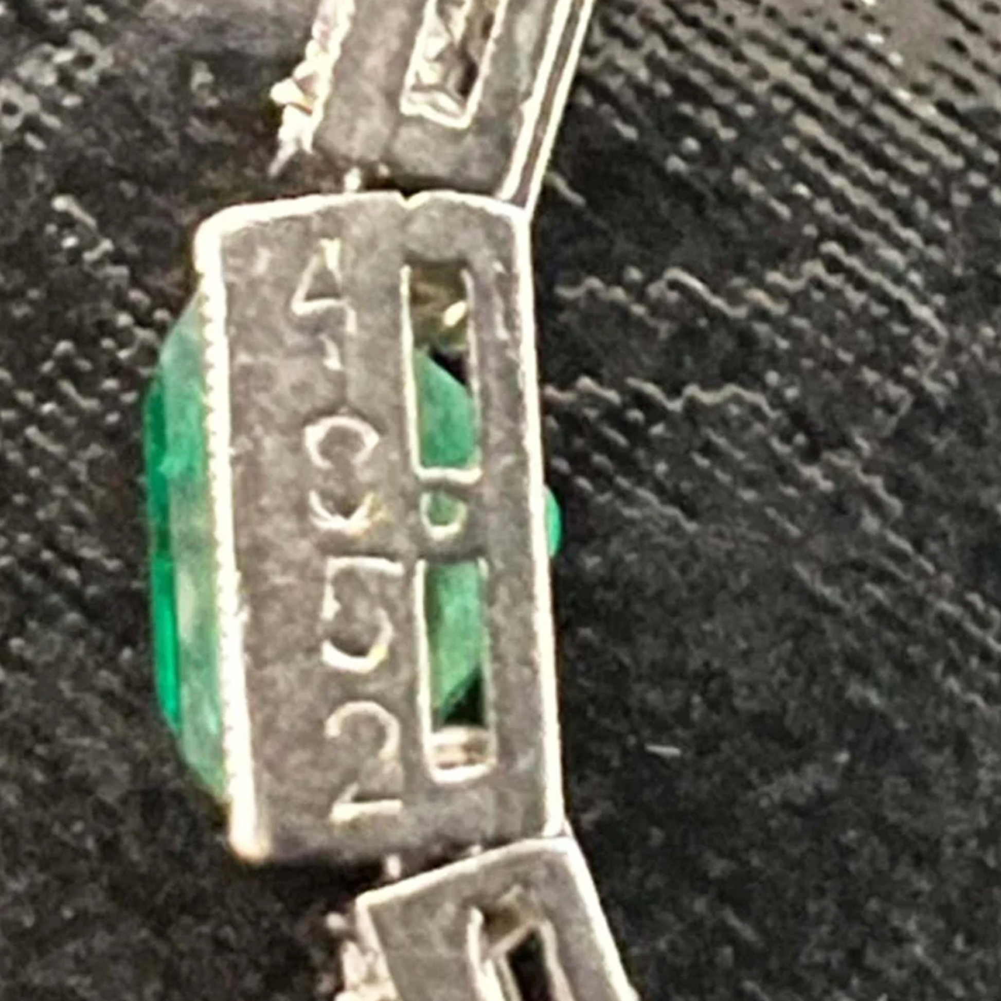 Cartier Art Deco Platinum Diamond & Emerald Bracelet close-up of number