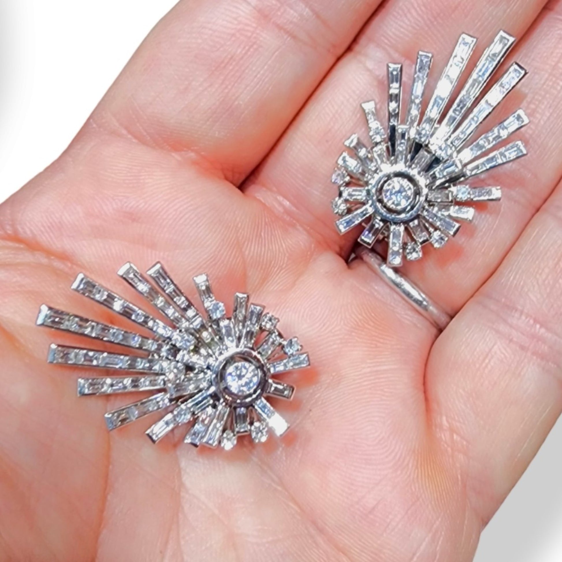1960s Platinum Diamond Shooting Star Earrings in hand