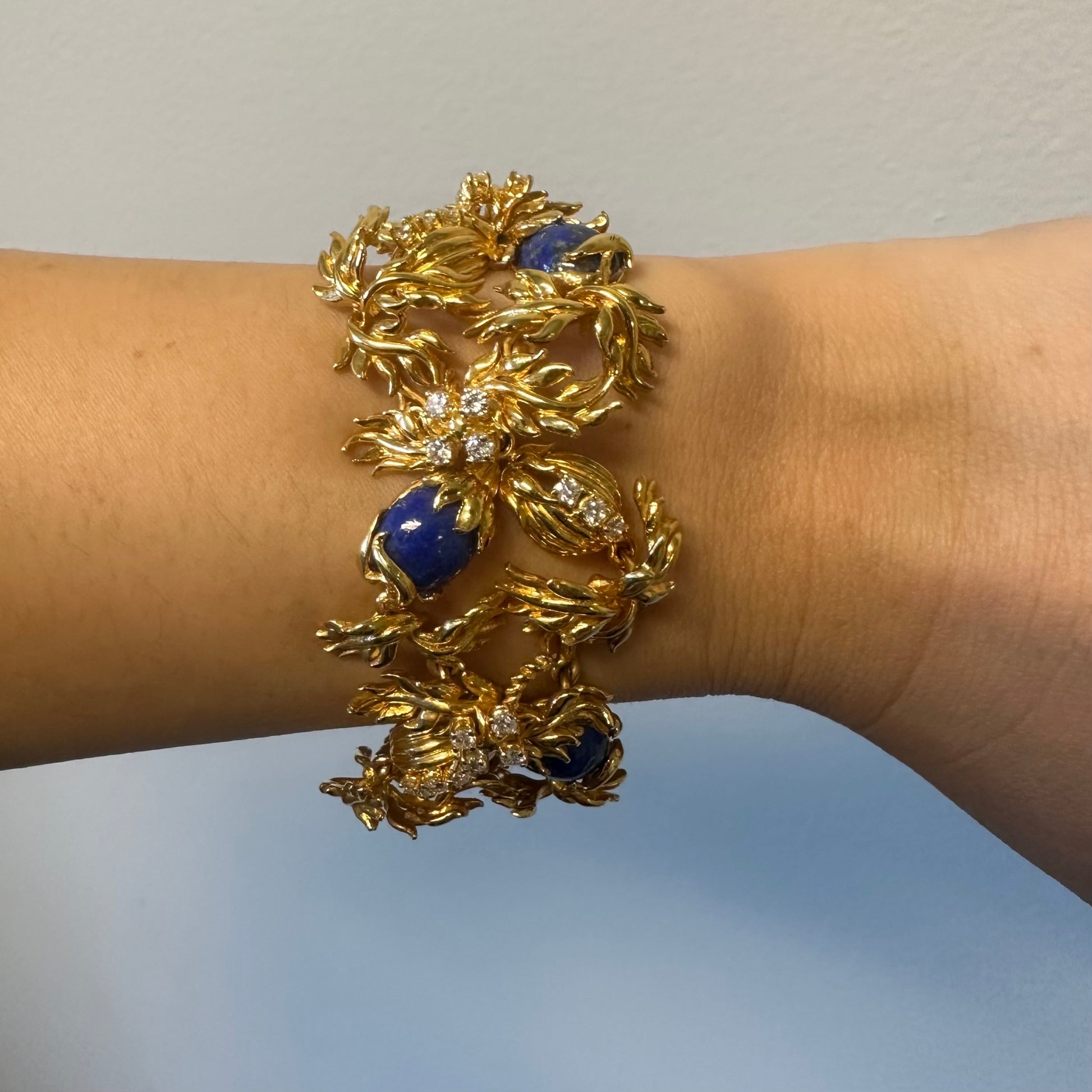 Cartier Aldo Cipullo 1970s 18KT Yellow Gold Lapis Lazuli & Diamond Bracelet on wrist