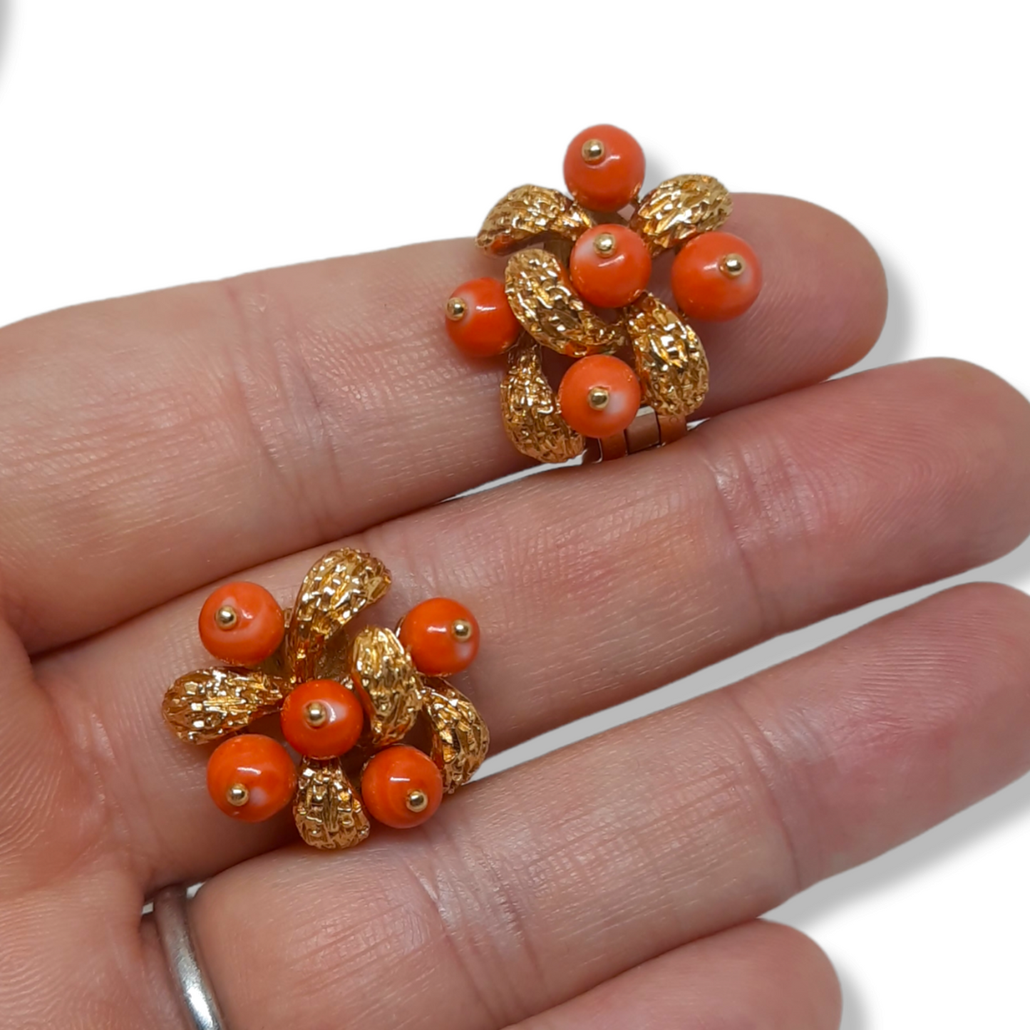 Van Cleef & Arpels French 1970s 18KT Yellow Gold & Coral Earrings in hand